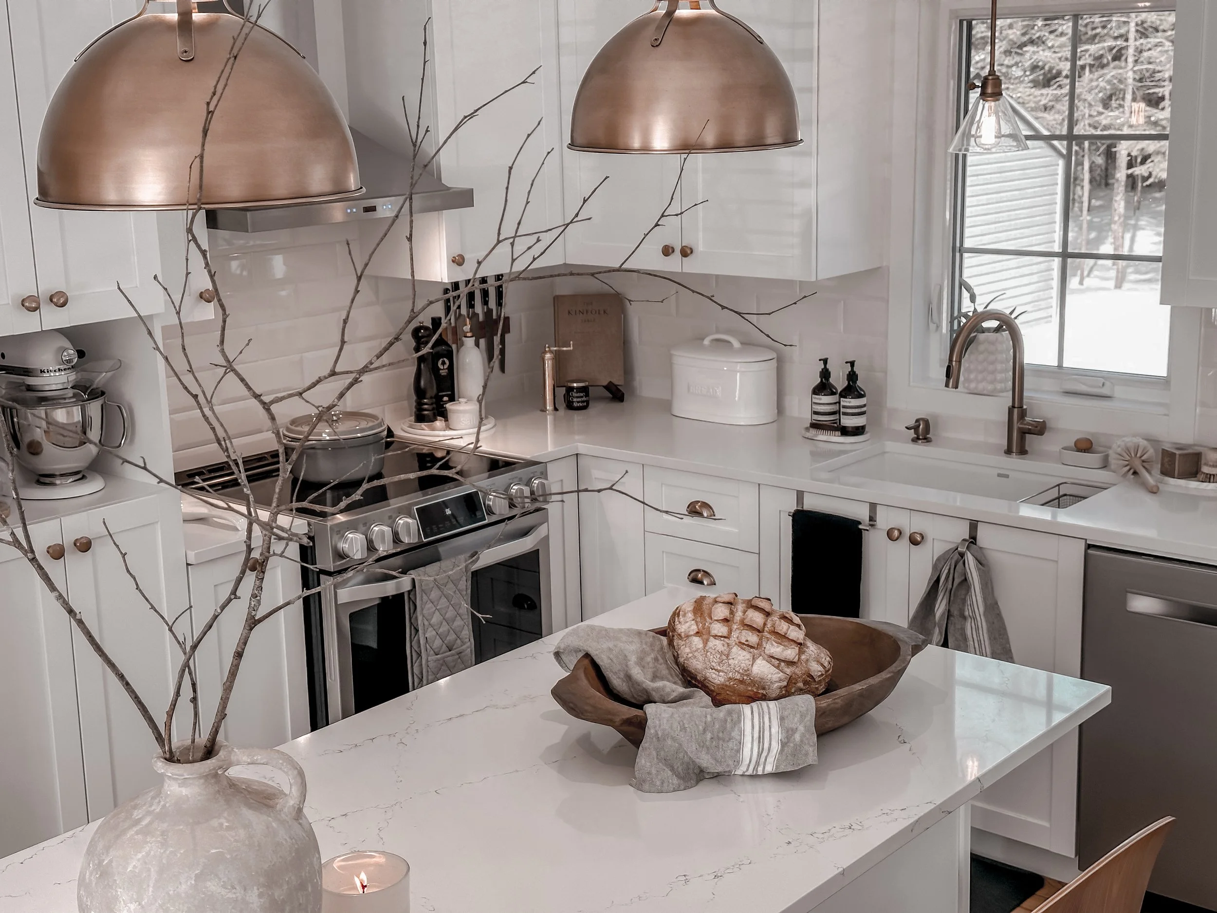 AFTER | White quartz counters, new island, new lighting, new backsplash, new sink & faucet, new hardware on cabinets.