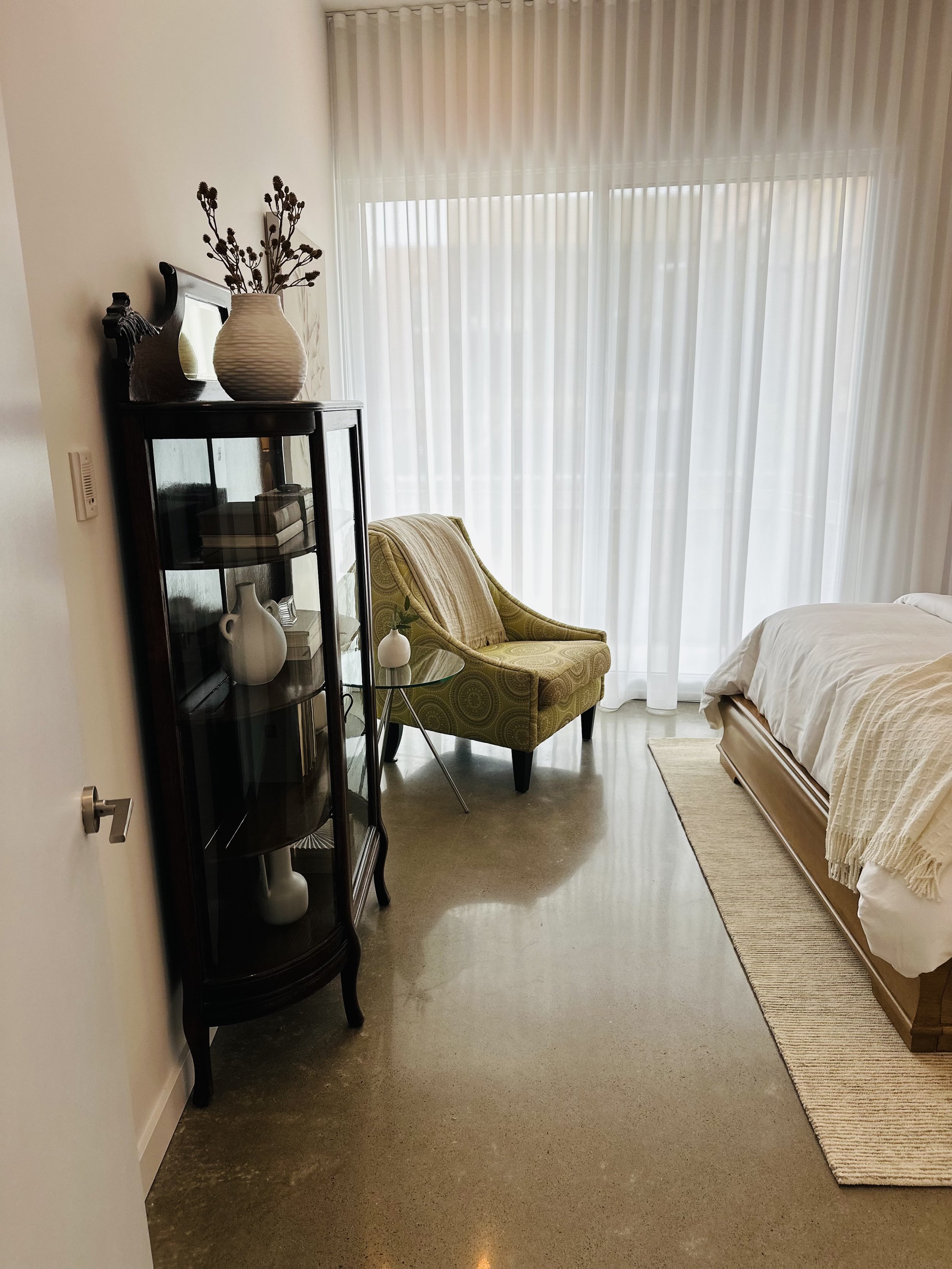 AFTER - space feels twice as large (curio cabinet gets a new lease on life)