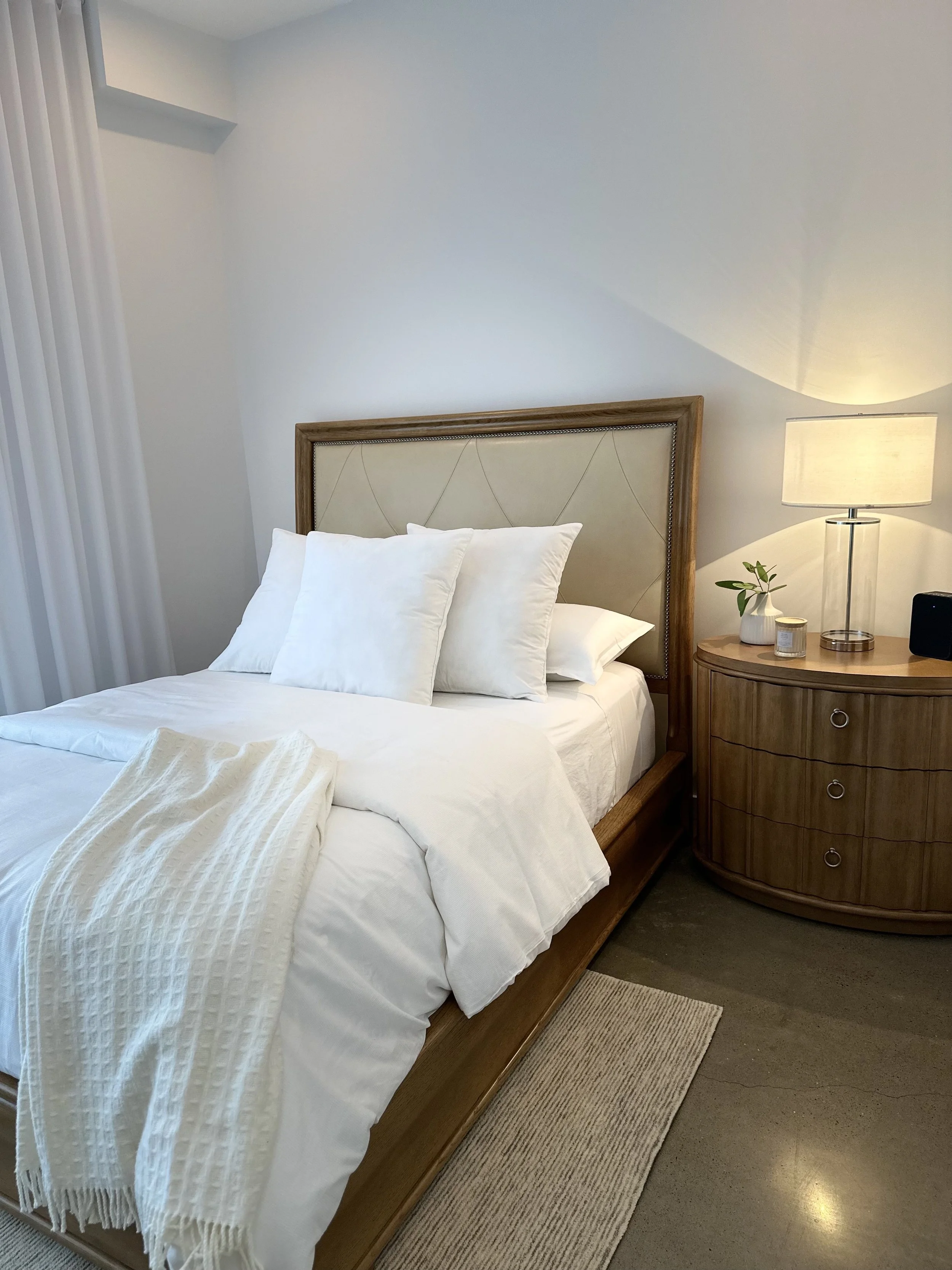 AFTER - heavy furniture looks renewed and space is softer (hotel feel)