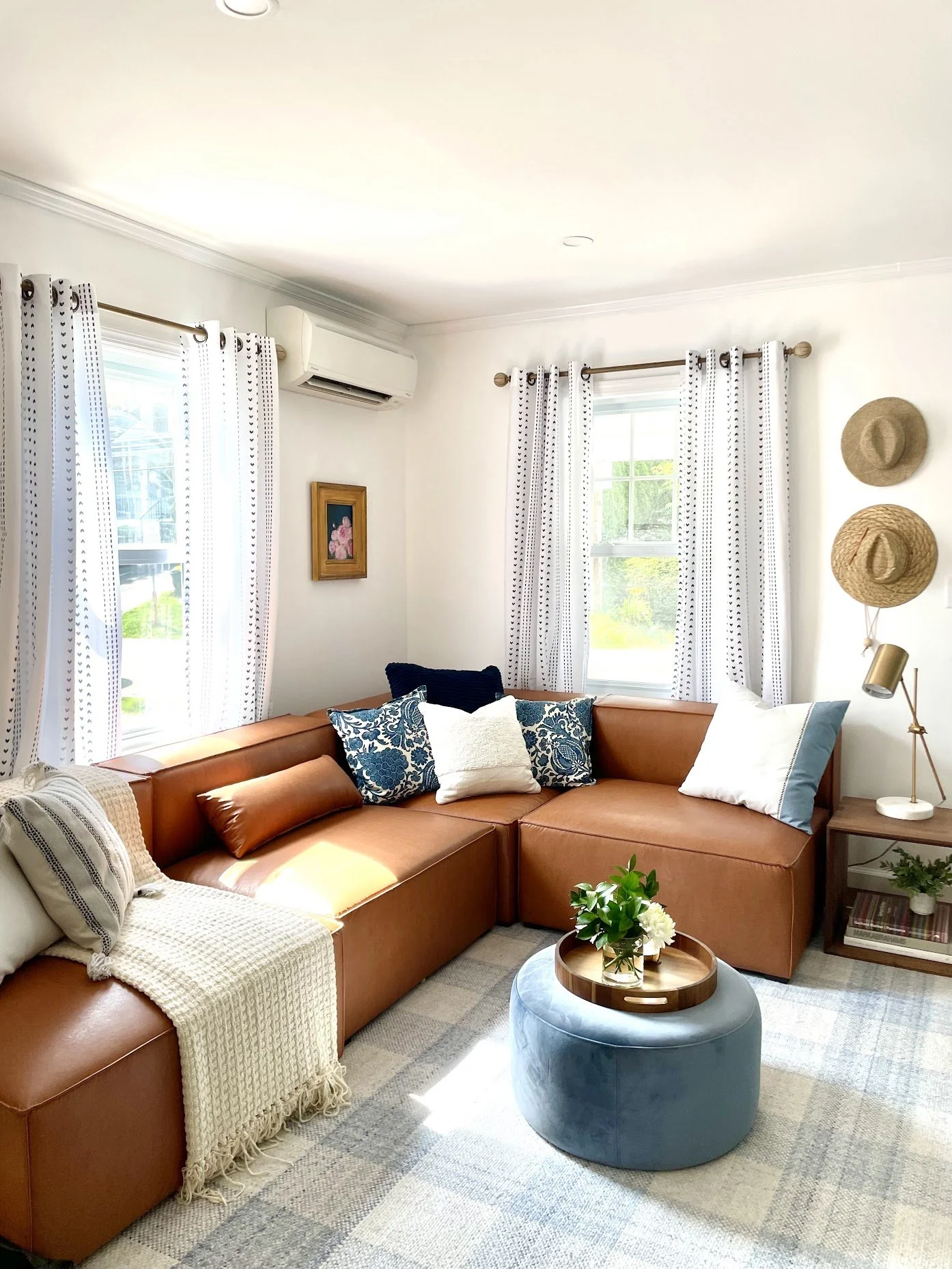 coastal cottage core , camel leather sofa, boho living room, blue white, Noel Gatts design HGTV