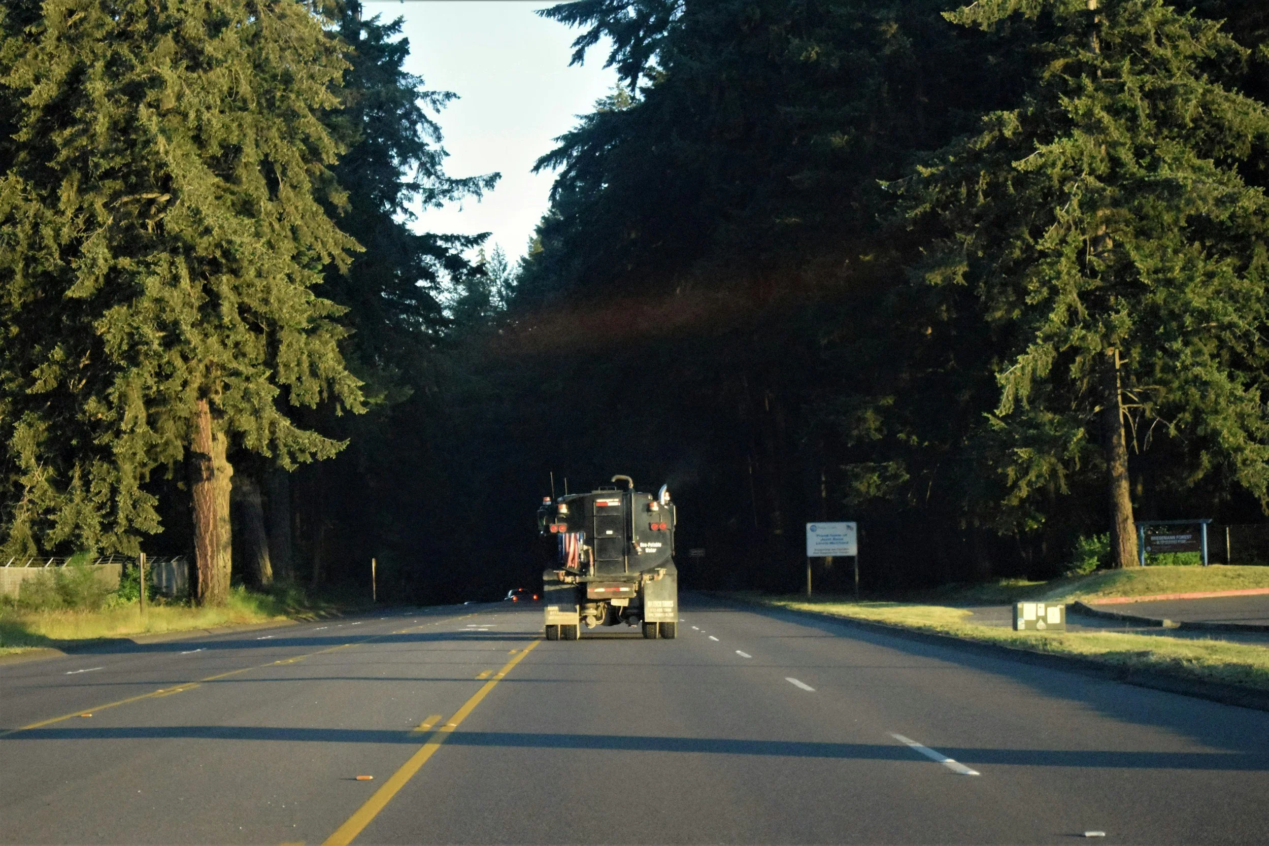 Road striping crew on the road.