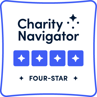 Charity Navigator Four-Star logo with blue star icons and rounded border.