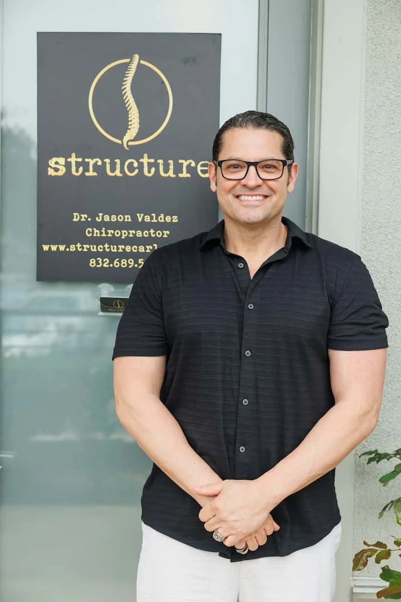 Dr. Jason Valdez DC standing outside Structure Chiropractic clinic Carlsbad CA