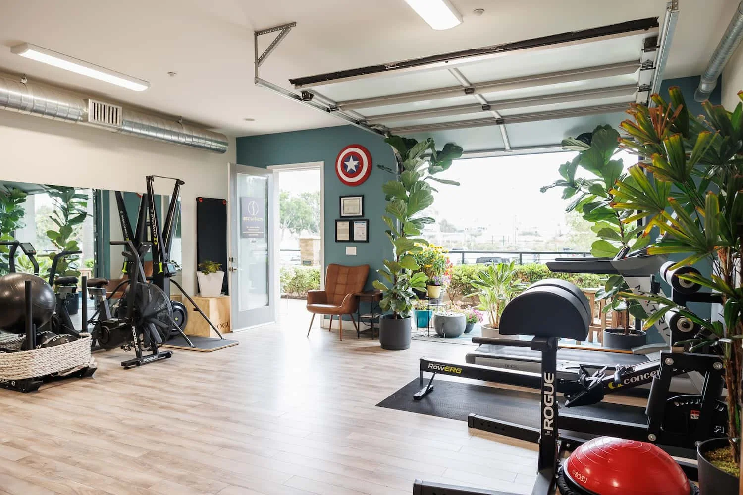 Chiropractic clinic gym with rehab and strength training equipment Carlsbad CA