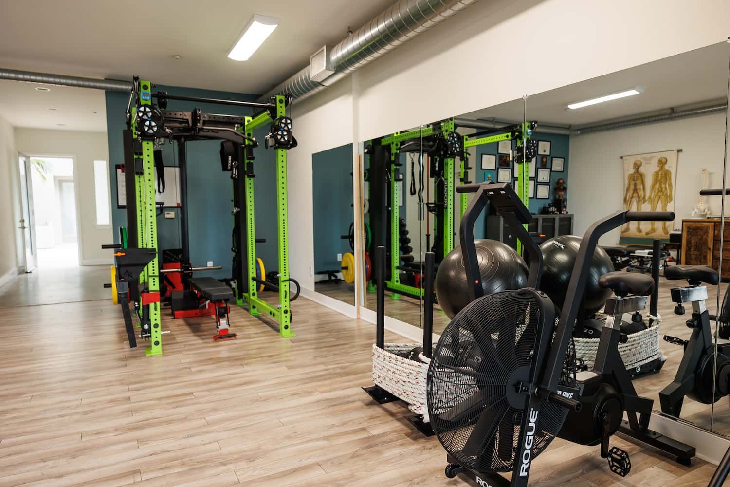 Chiropractic strength and rehab gym with power rack at Structure Chiropractic Carlsbad CA