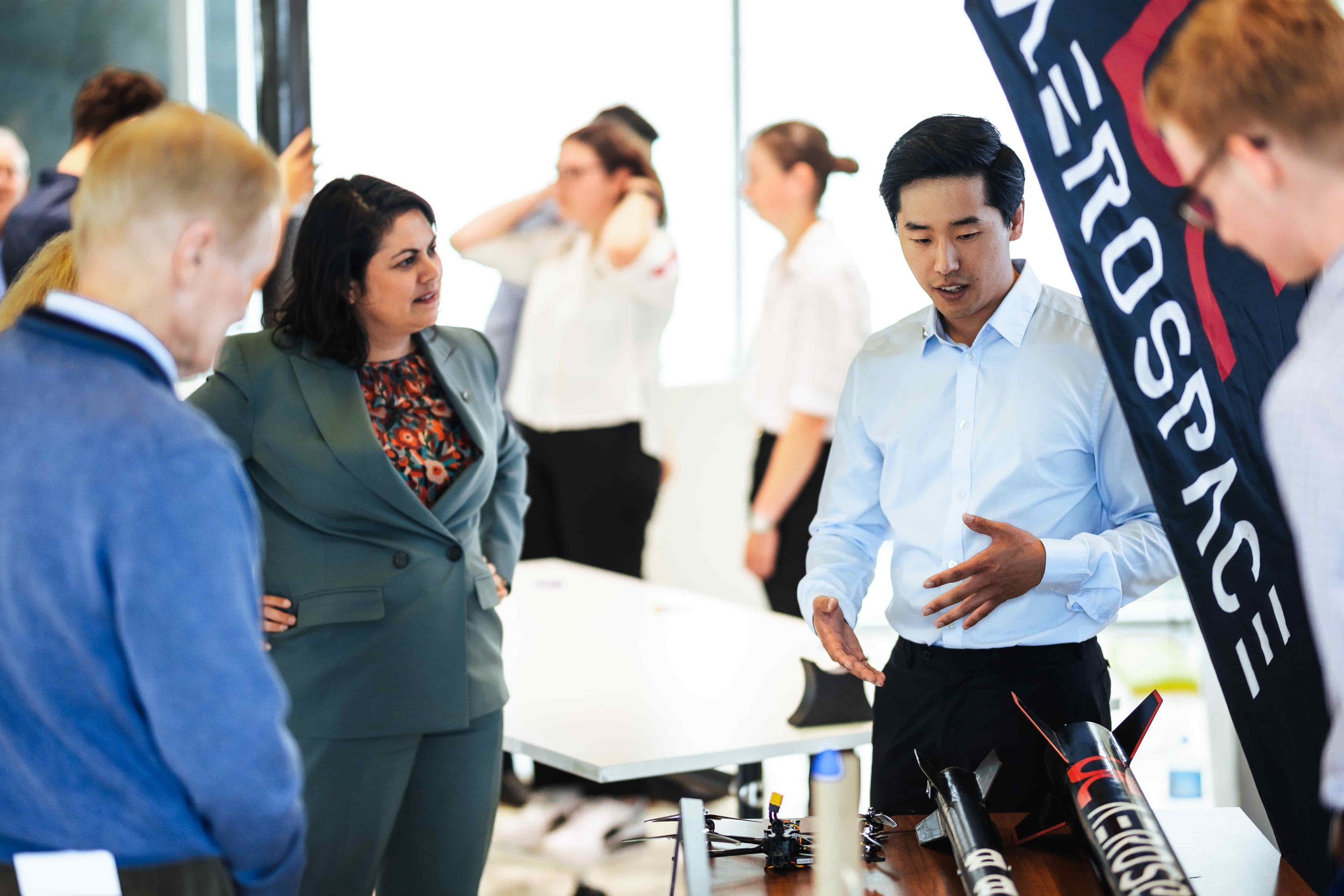   UC Aerospace President Peter Lee speaking with NASA Administrator Bill Nelson, and Hon Minister Dr Ayesha Verrall.  