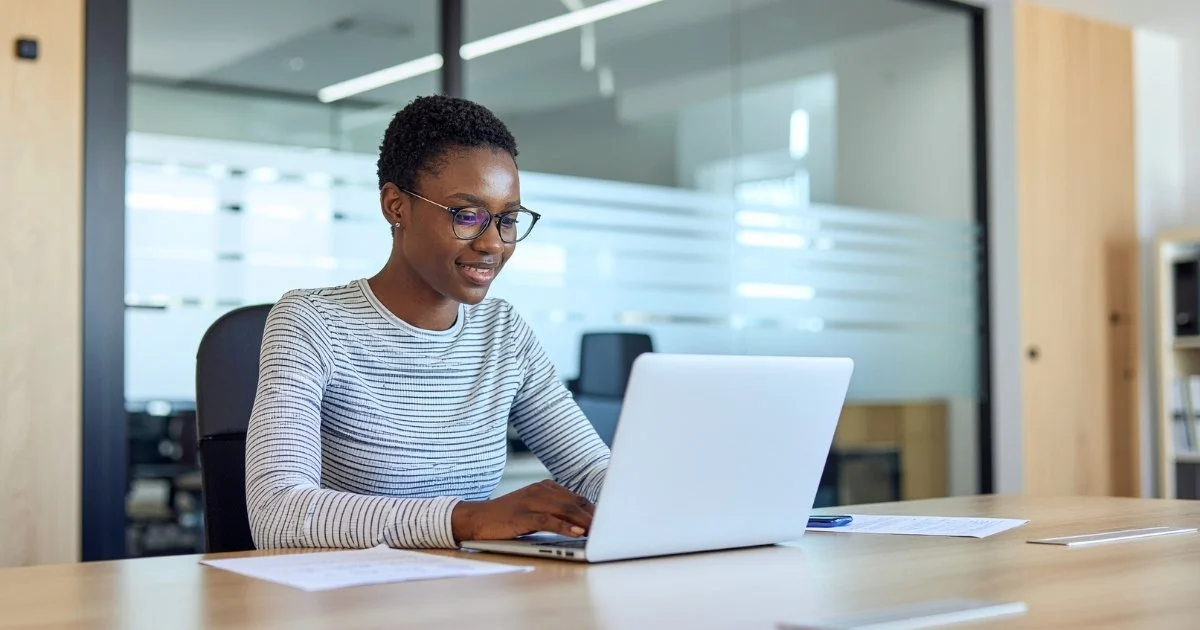 Professional using everyday digital tools as AI becomes embedded in daily business workflows.jpg