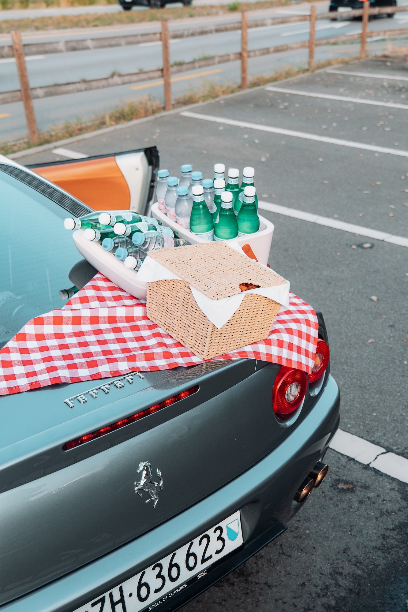Smell of Classic hosting a picnic stop with snacks served on the back of a silver Ferrari 360, One Tank Tour