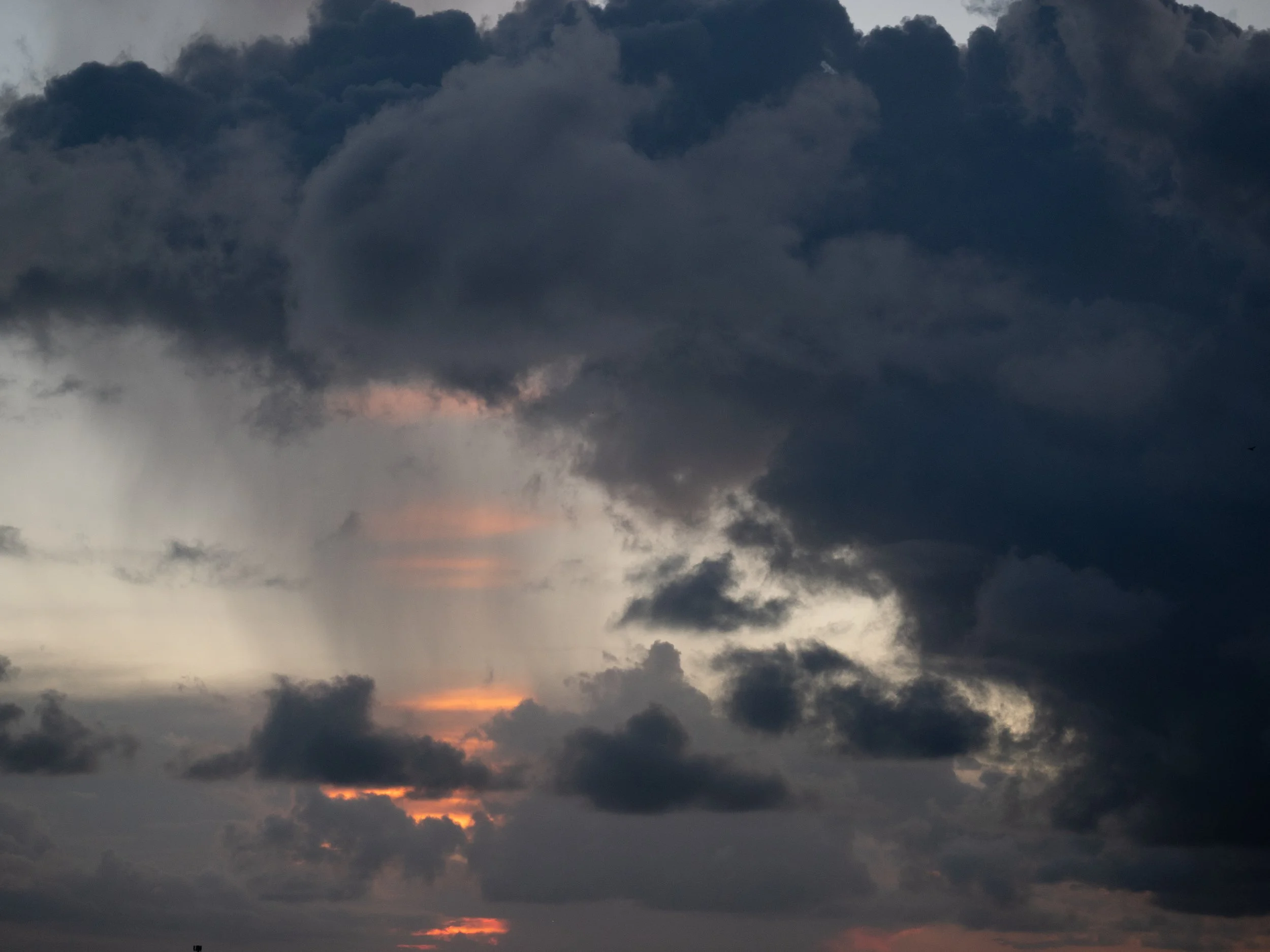 Dramatic clouds and warm sunset light over Savannah