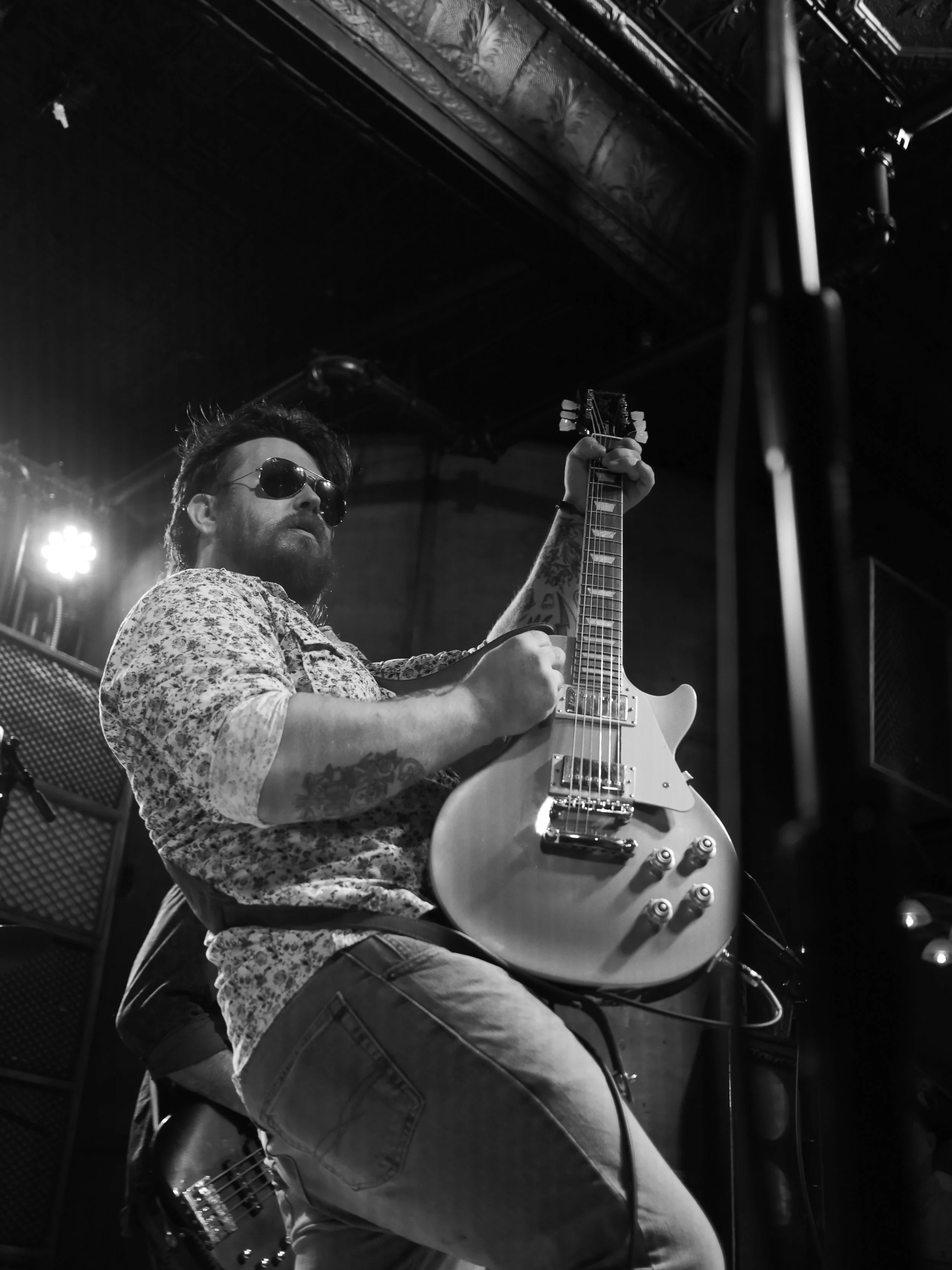 Delta Circle guitarist Darrell Anthony performing under stage lights at Honky Tonk South in Savannah.