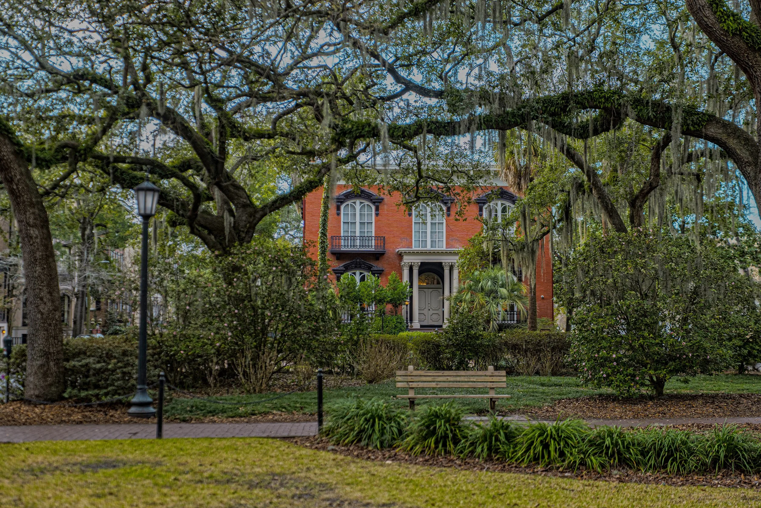 Mercer Williams House seen through live oak trees in Savannah, Georgia.