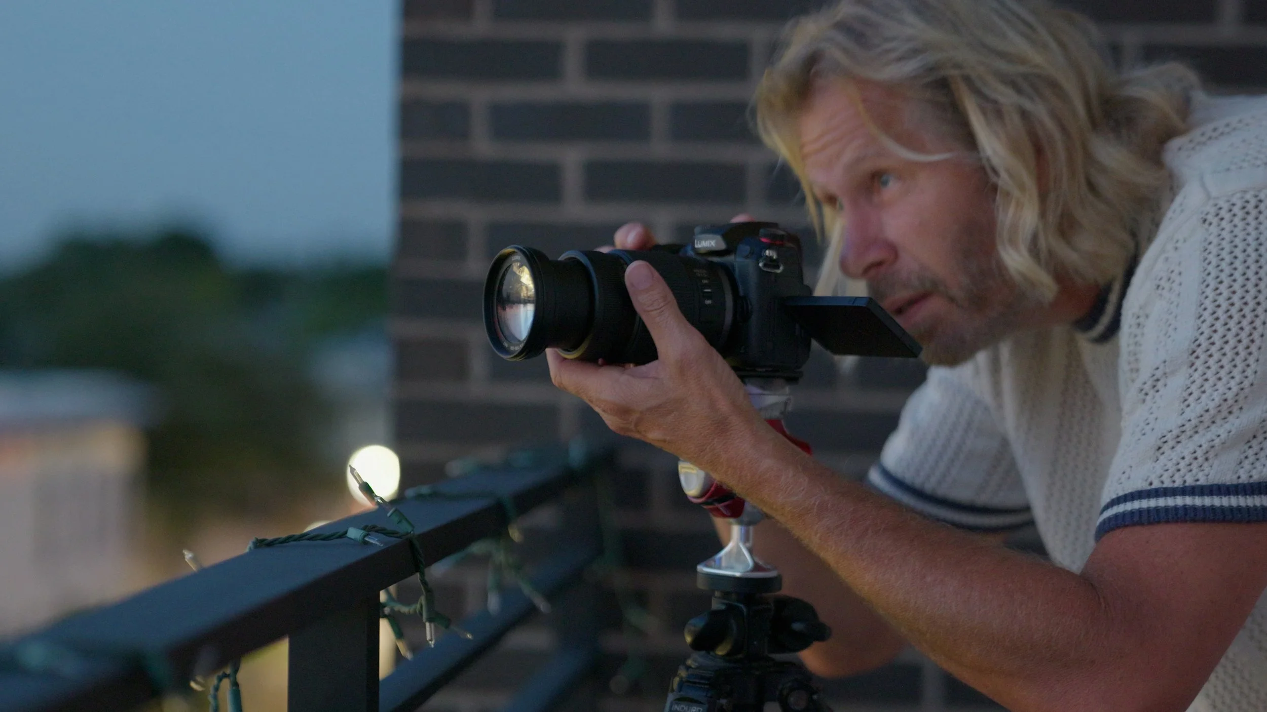 Charles Maring photographing the Savannah skyline from a downtown terrace.