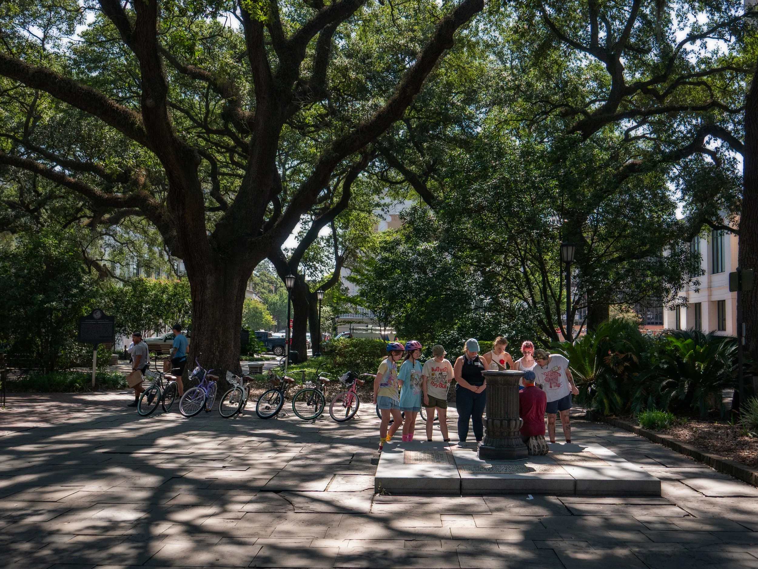 Savannah bicycle tour group gathered around the sundial in Johnson Square.