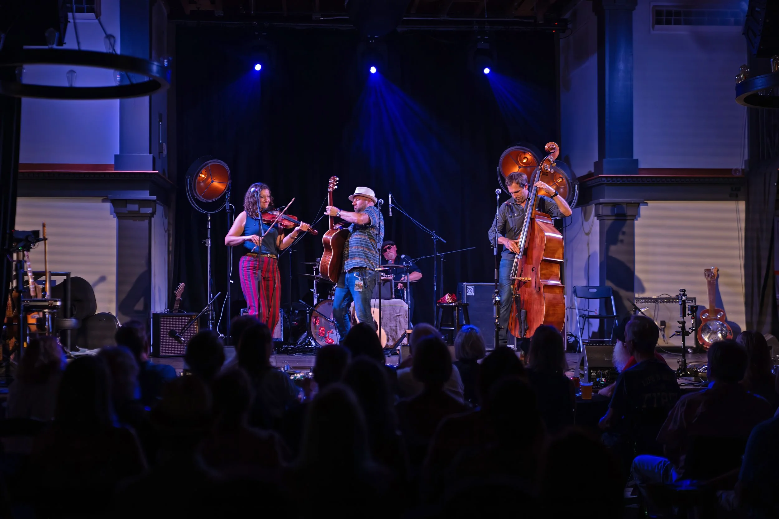 The Accomplices performing live at Victory North during Homegrown Summer Jam 2026 with the audience watching from the floor.