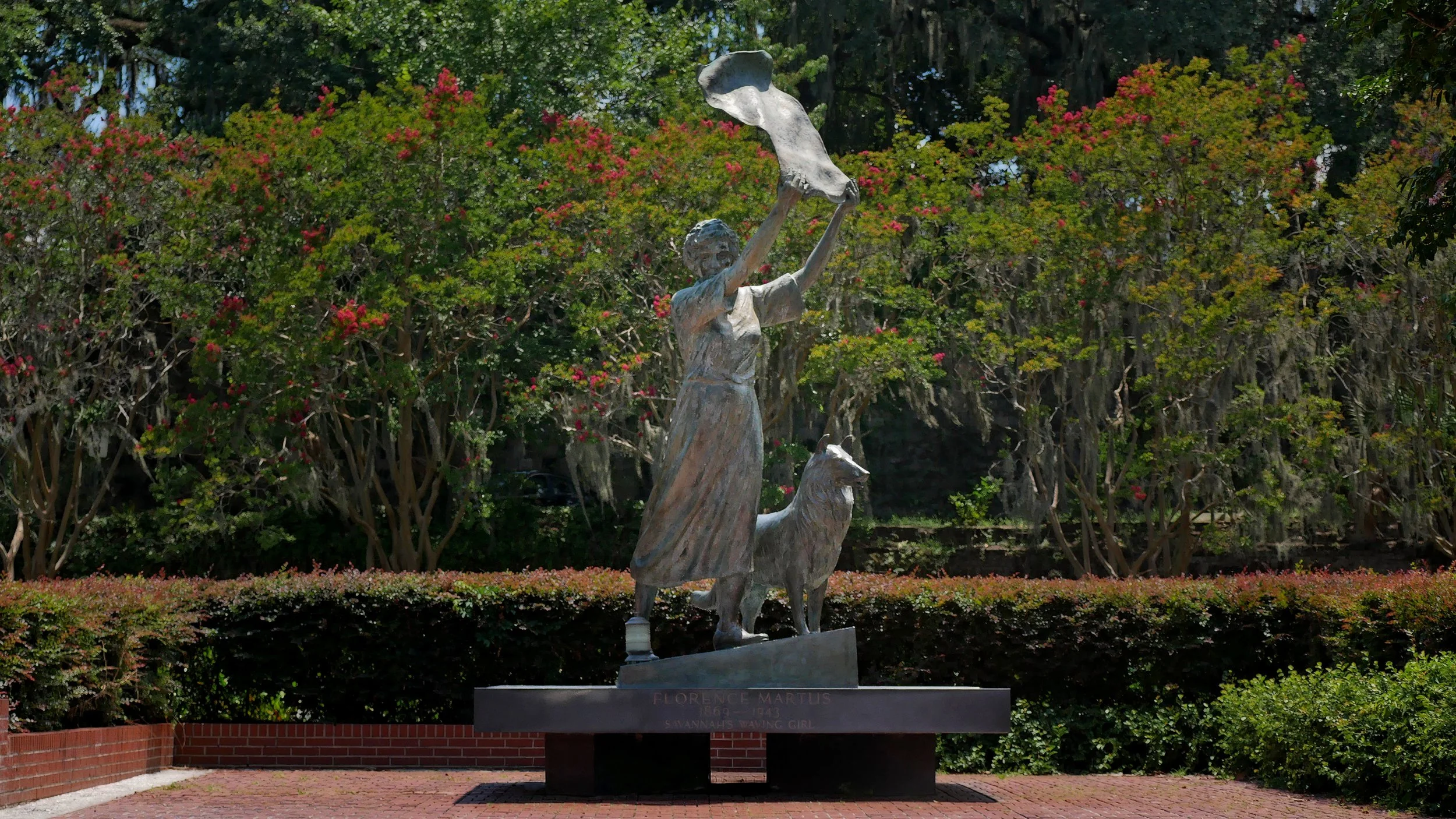 The Waving Girl statue of Florence Martus overlooking the Savannah River with her faithful collie at Morrell Park in Savannah, Georgia.