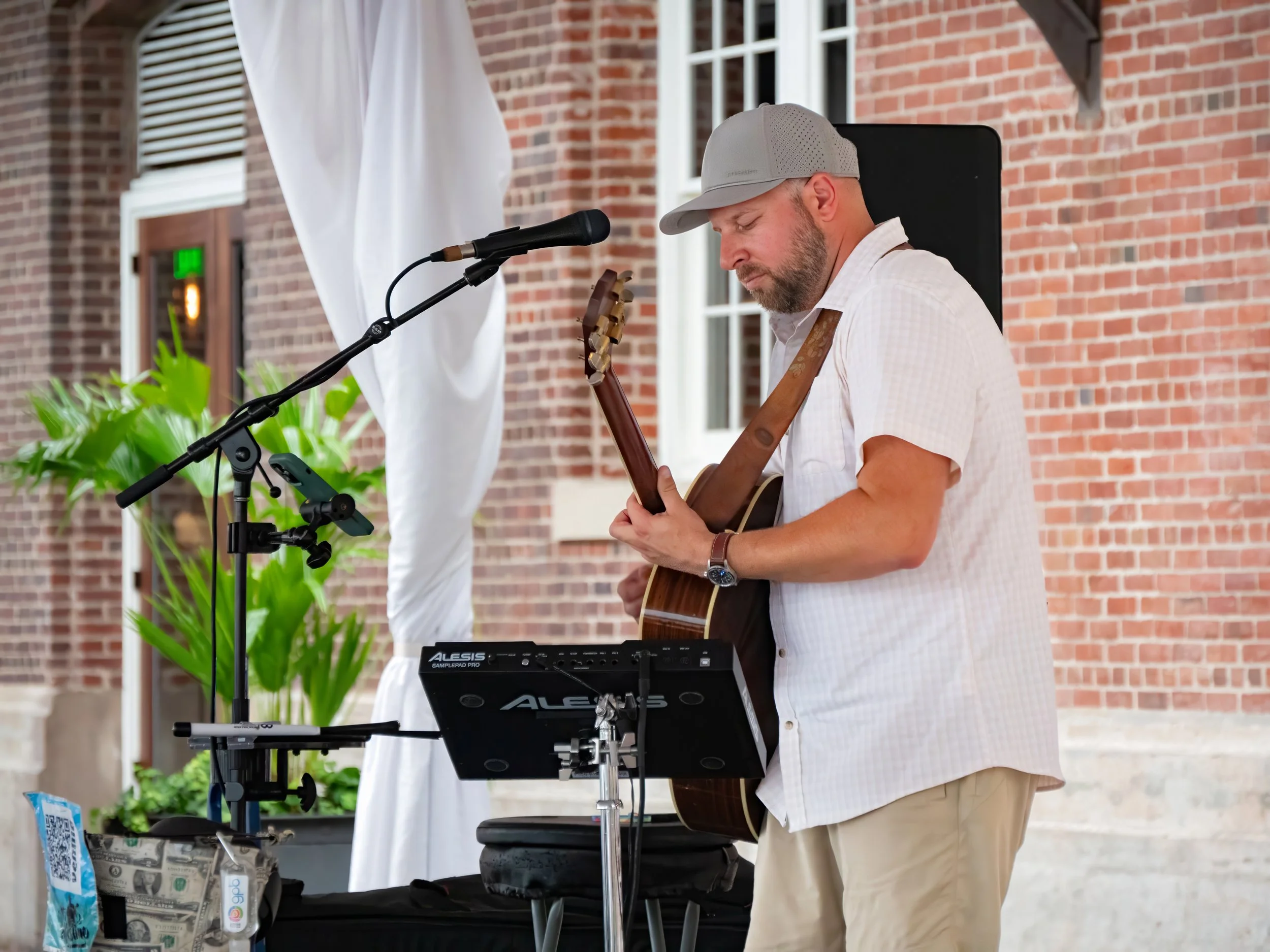 Matt Eckstine performs live in Savannah, Georgia as a solo musician blending acoustic guitar, live looping, and expressive lead guitar riffs during an intimate performance.
