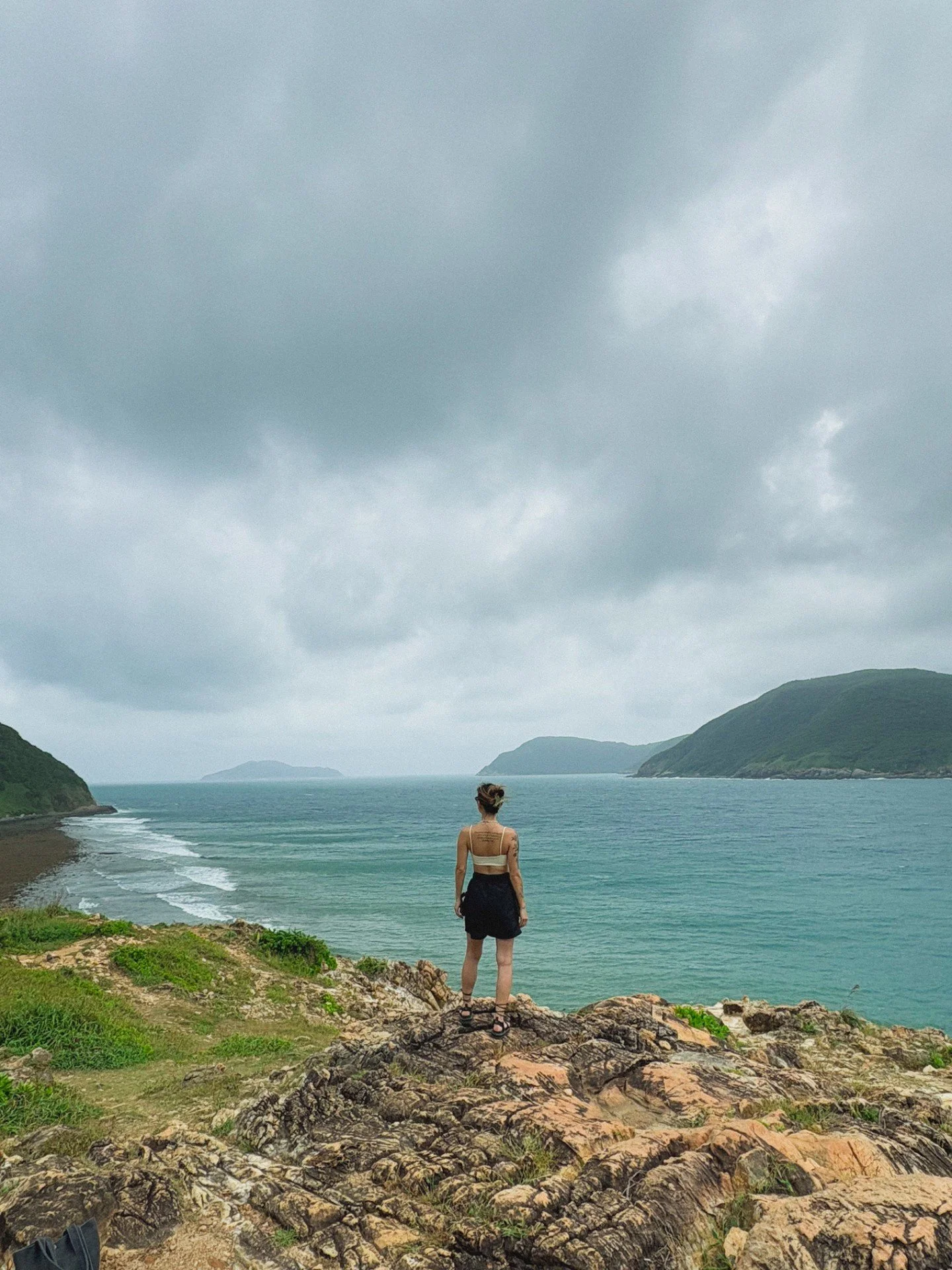 Standing here feeling like I'm on top of the world! 

We spontaneously pulled over on our moped to soak in this view &mdash; wind in our faces, zero plans, and another pit coconut water stop from a cute little truck 🧉

📍Con Dao 
🔗 Full island guid