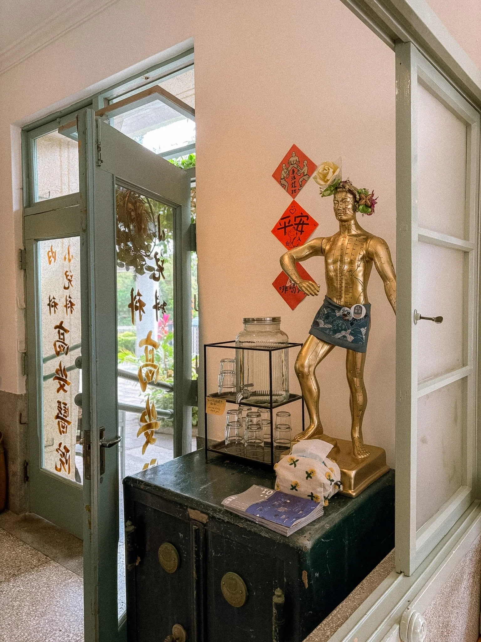 TiaoGang Cafe - entrance with statue and water.jpg