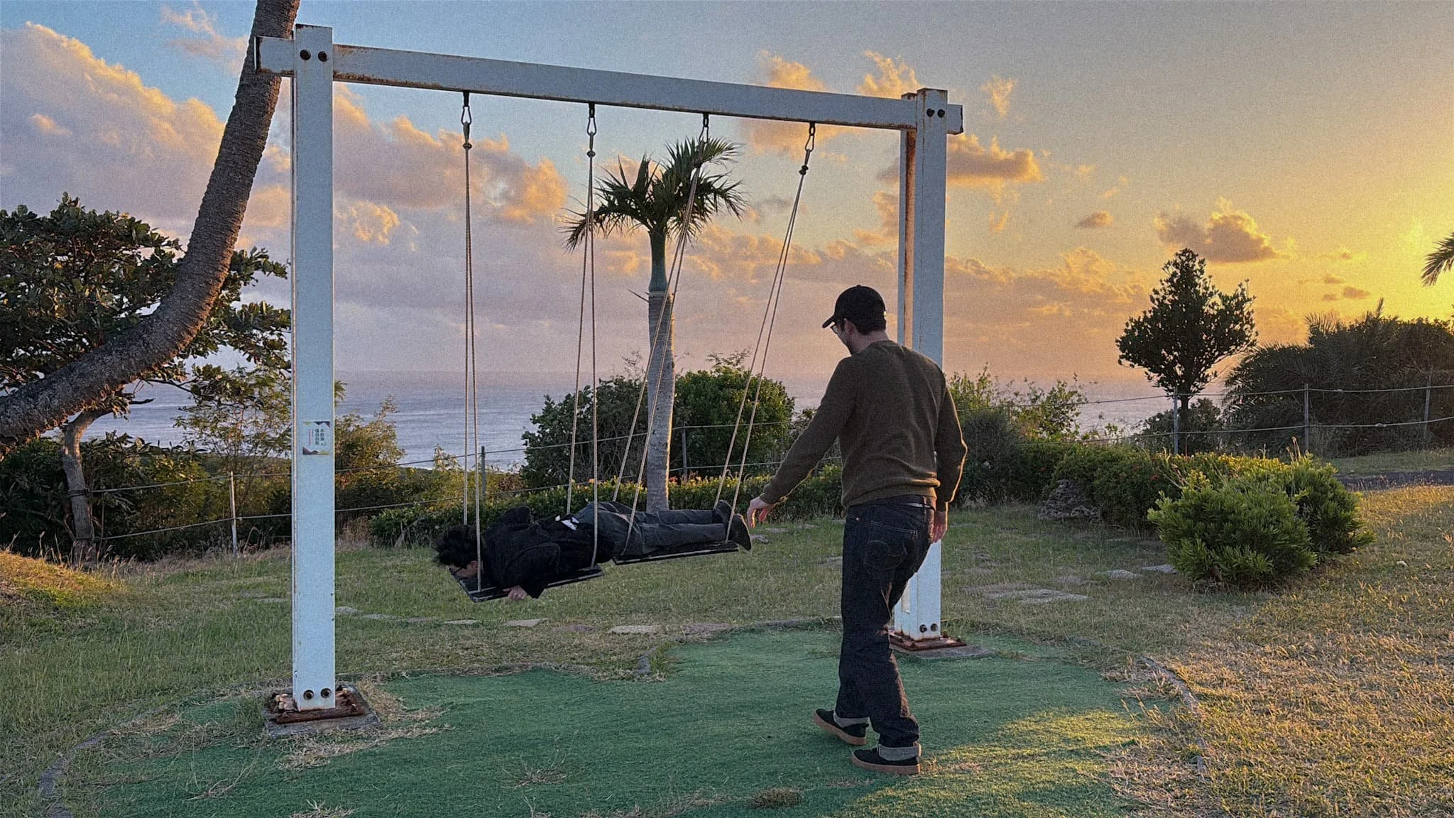 SkyeBay Club Kenting Taiwan and outdoor swing on property grounds at sunset