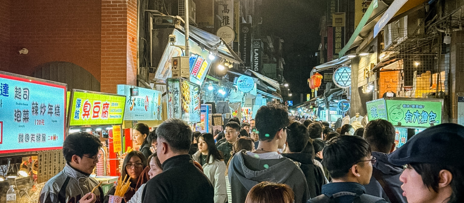Crowds exploring street food stalls at Shilin Night Market in Taipei, Taiwan, the city’s largest and busiest night market