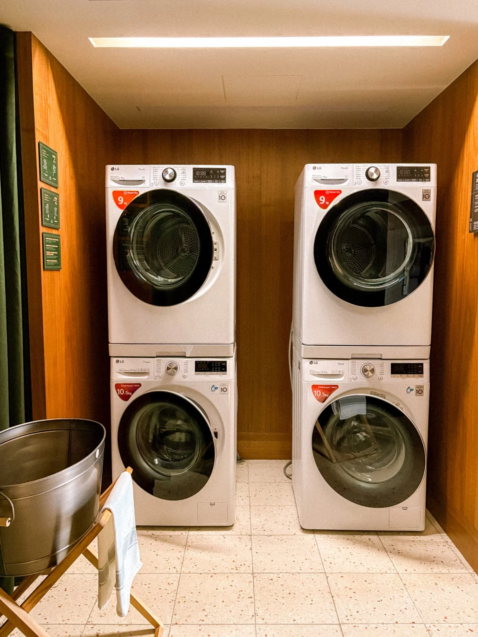 Shared laundry room at Provintia Hotel Tainan with stacked LG washers and dryers