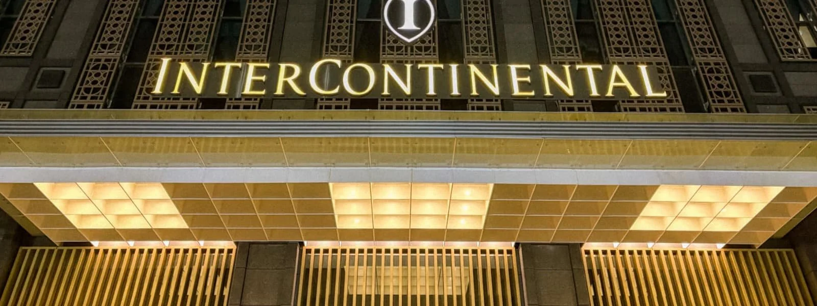 InterContinental Kaohsiung hotel entrance sign illuminated at night, luxury hotel in Kaohsiung Taiwan