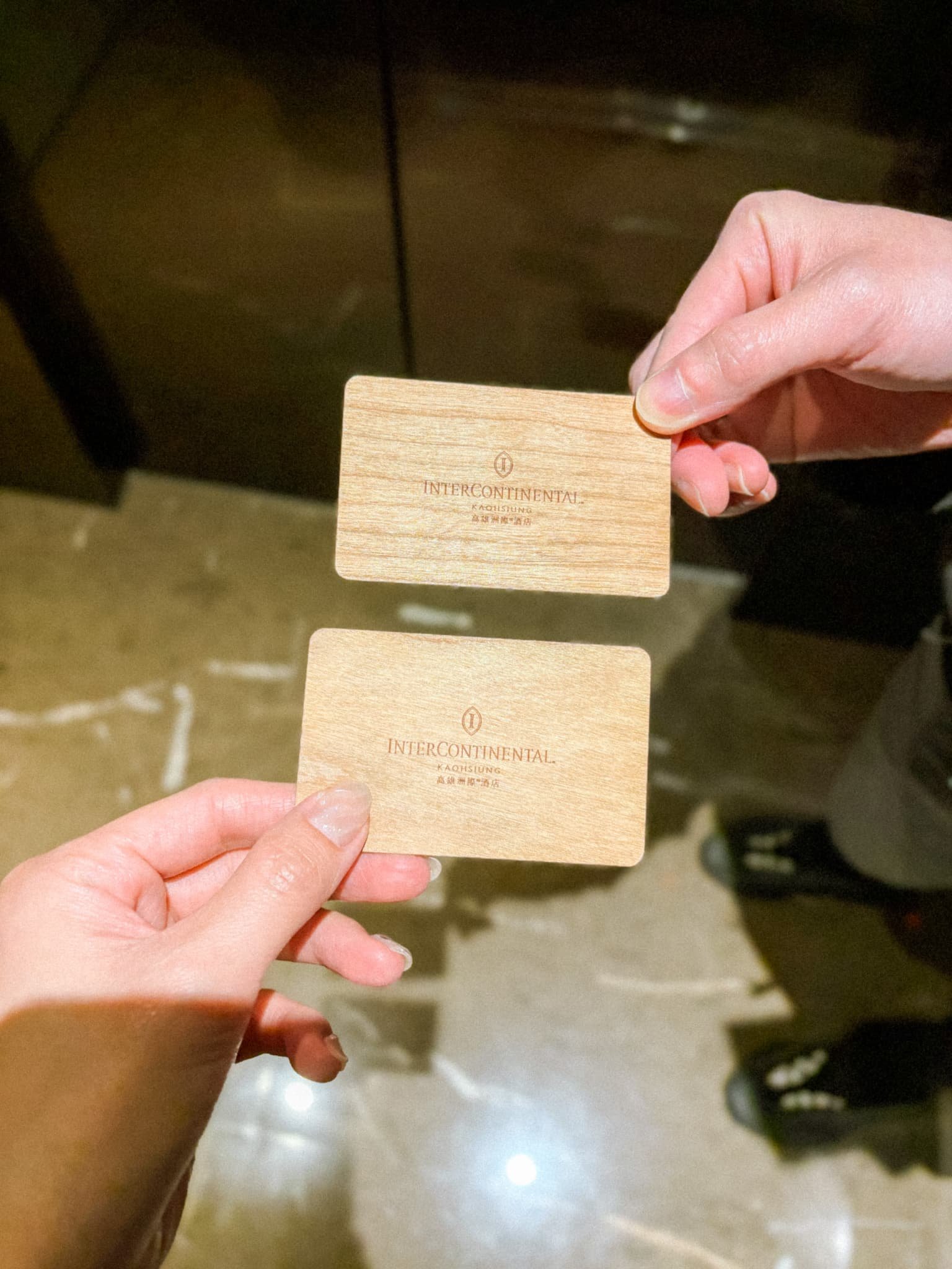 Two wooden room key cards for InterContinental Kaohsiung, a luxury hotel in Kaohsiung Taiwan