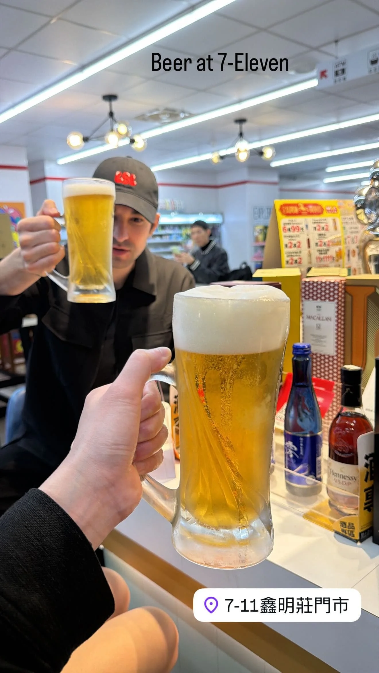 Two people toasting with fresh tap beer at Open Bar 酒BAR, 7-Eleven inside Liuhe Night Market Kaohsiung