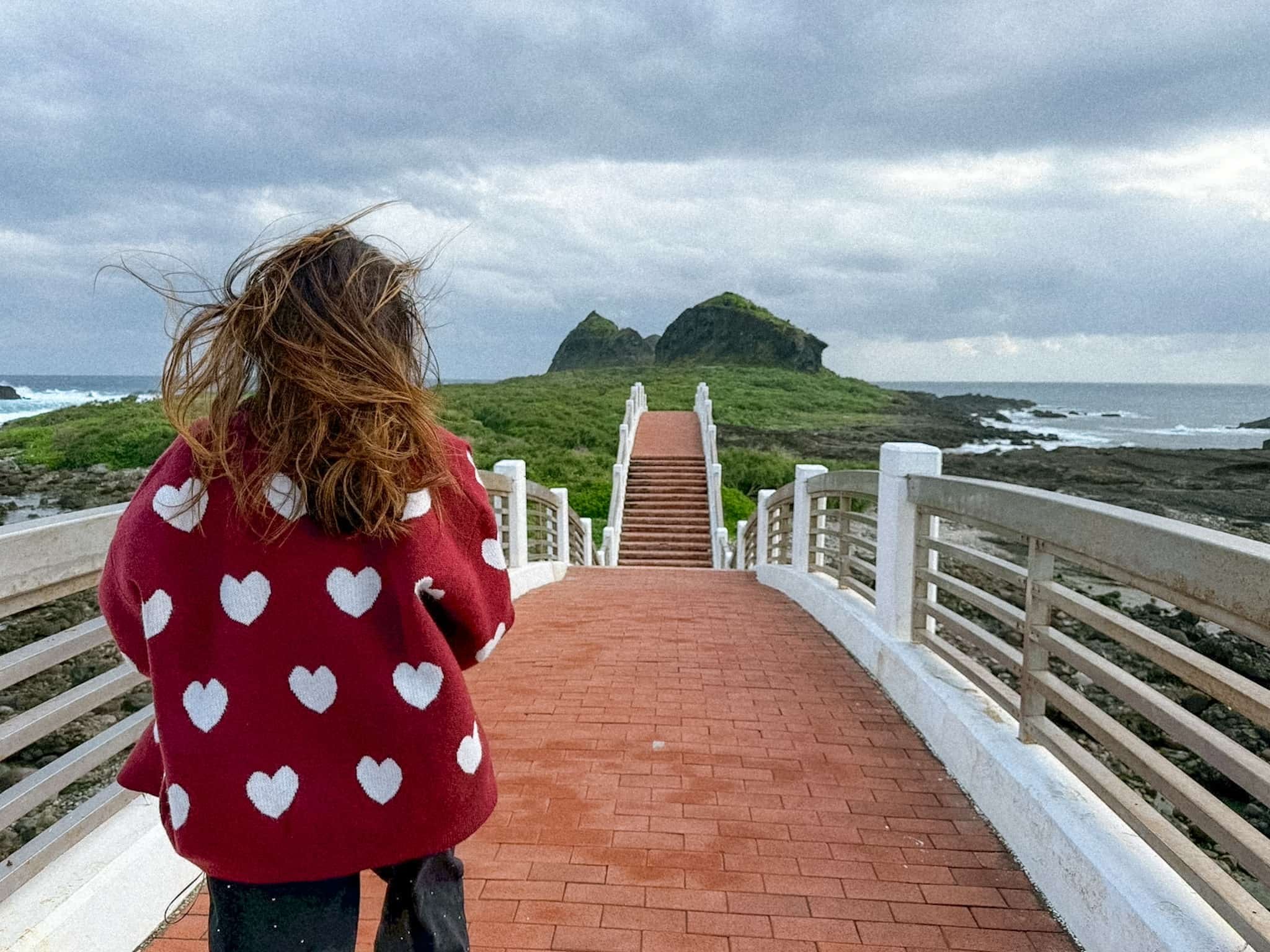Windswept walk across Sanxiantai's iconic eight-arch bridge overlooking Taitung's coastline