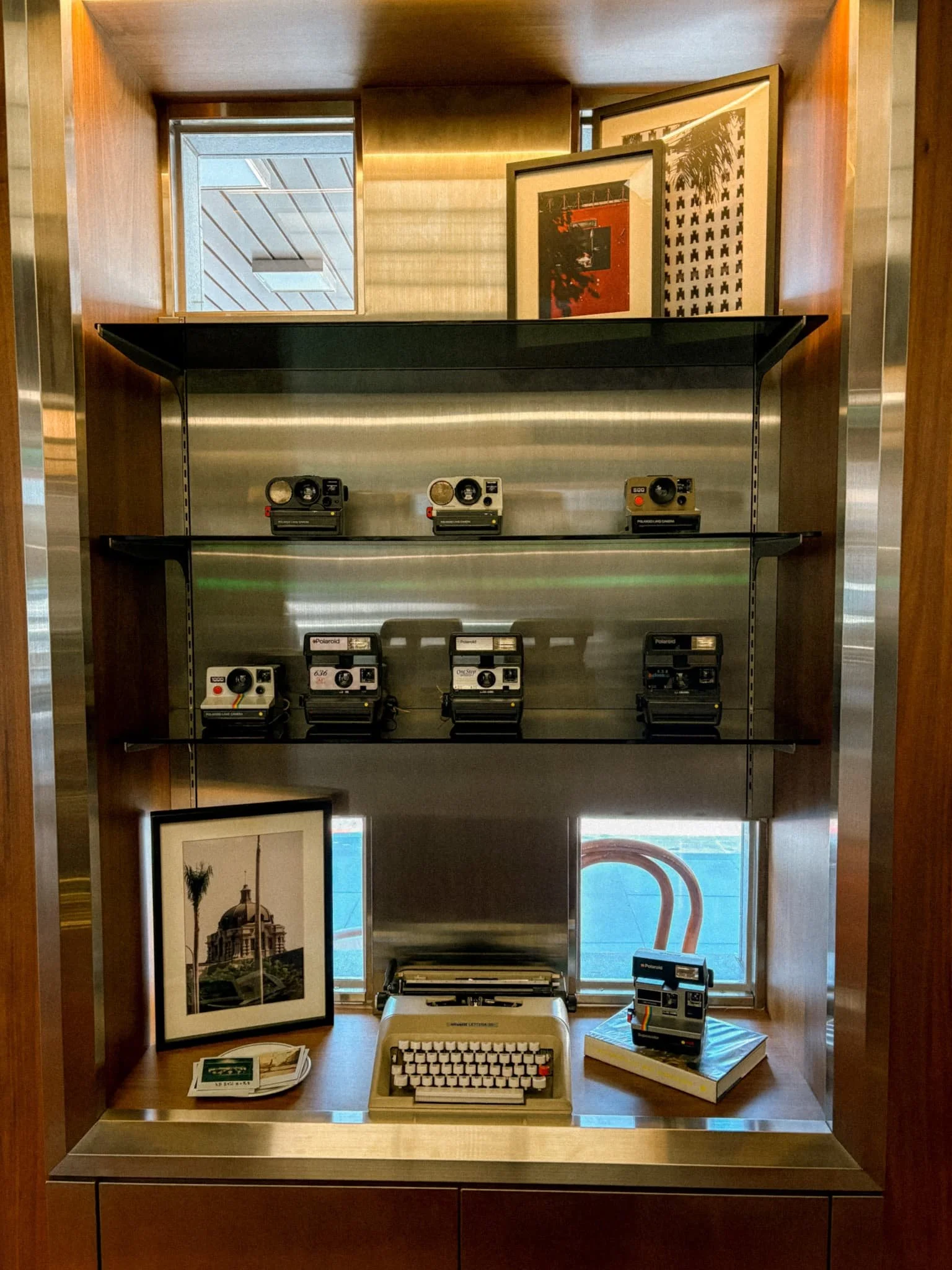 Vintage Polaroid cameras and typewriter display in Provintia Hotel Tainan's retro lobby