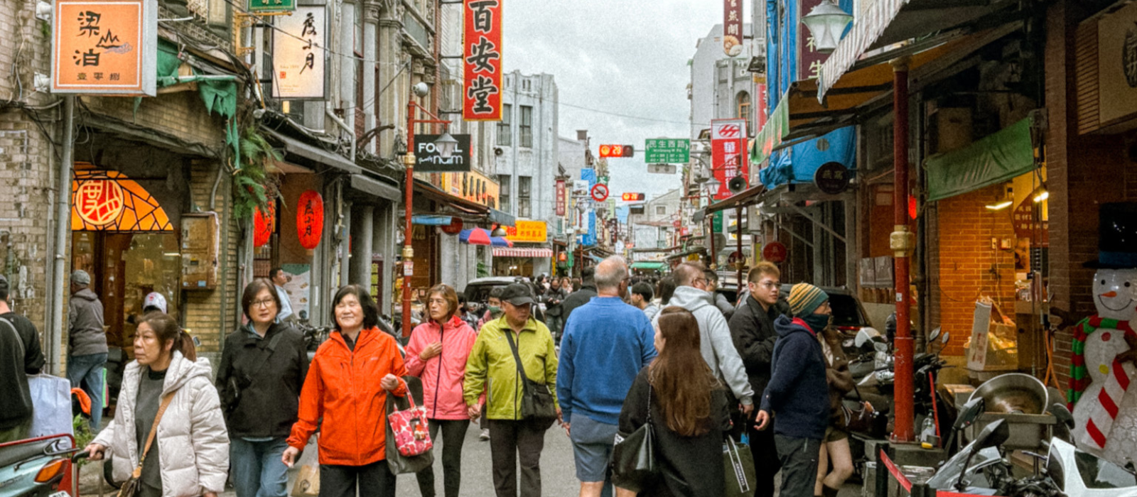 Dihua Street Taipei with crowds, historic shop houses, and local vendors in Dadaocheng district