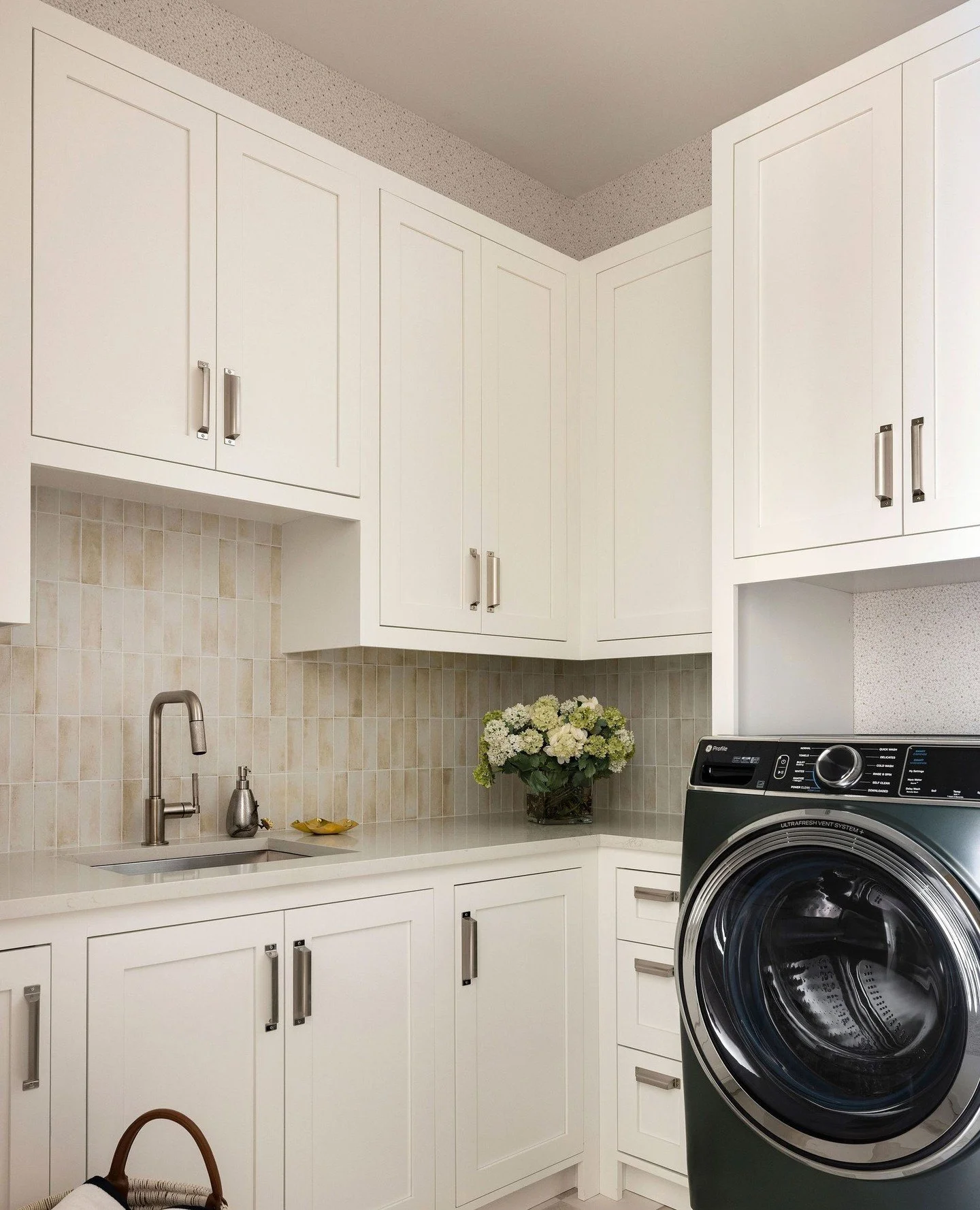 Laundry might not be our favorite chore, but these rooms make a pretty good case for it. ⁠
⁠
In the main laundry room, we brought in pattern with @wallquest wallpaper, added greenery from @ndidesigns, and finished the cabinetry with @topknobs hardwar