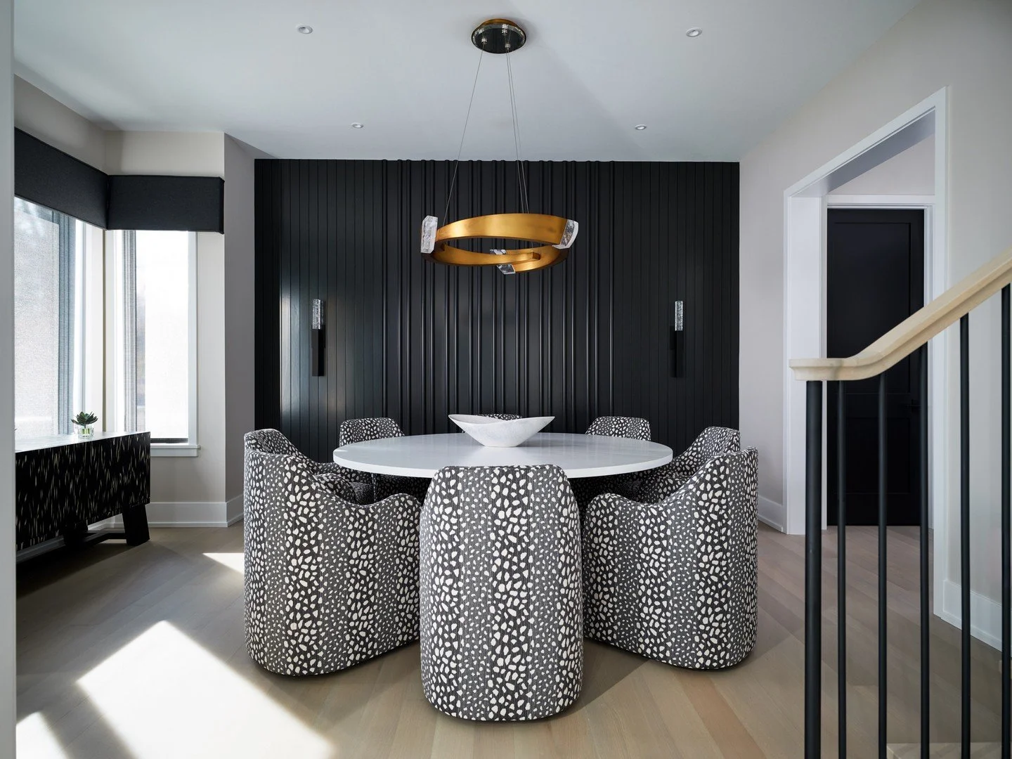 One of our favorite parts of the design process is finding the thread that ties everything together.⁠
⁠
For this dining room, it started with a fabric. The organic pattern on the @bernhardtfurniture chairs inspired a layered palette of black, white, 