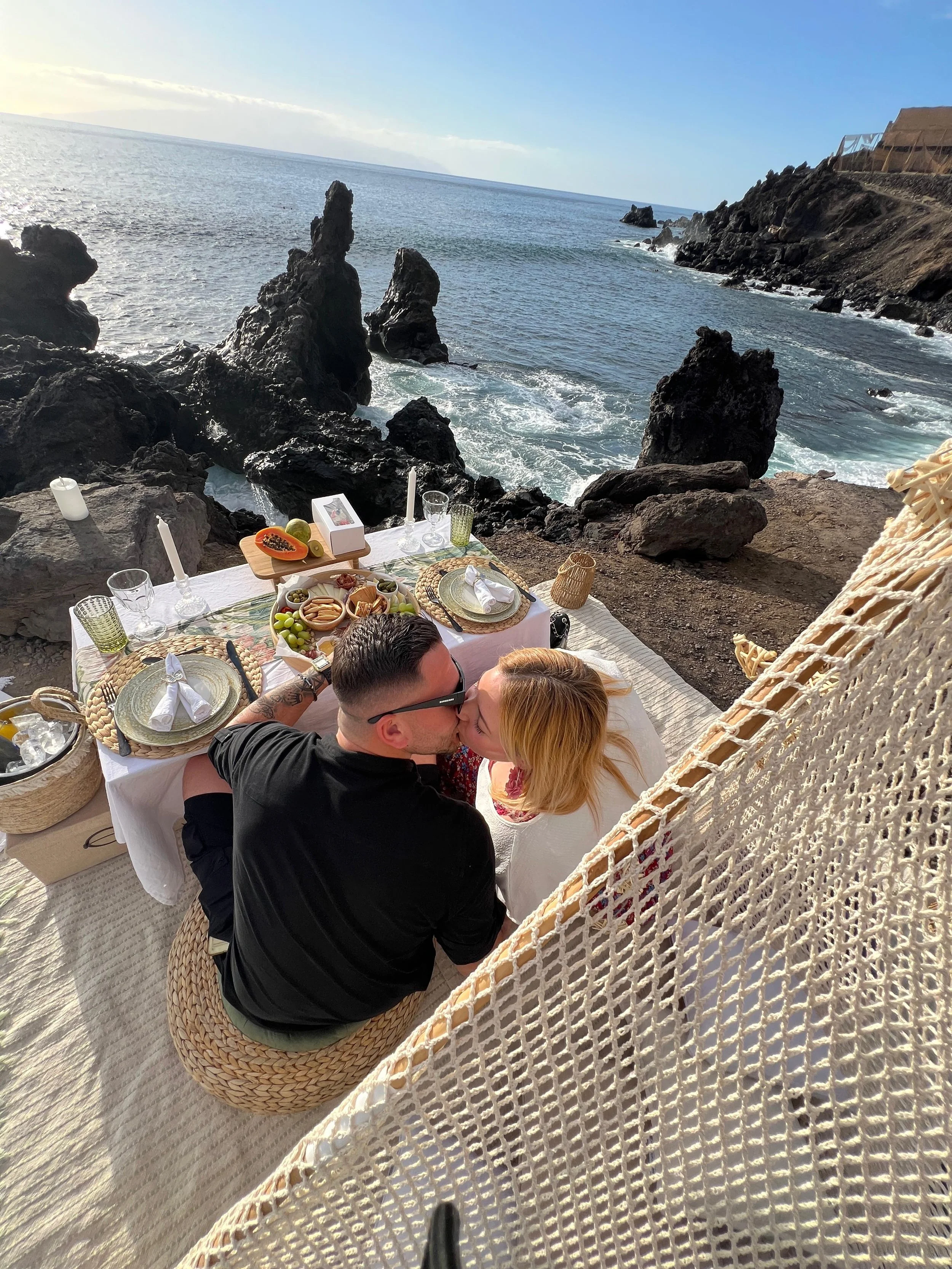 Couple enjoying a romantic luxury picnic during a Tenerife holiday