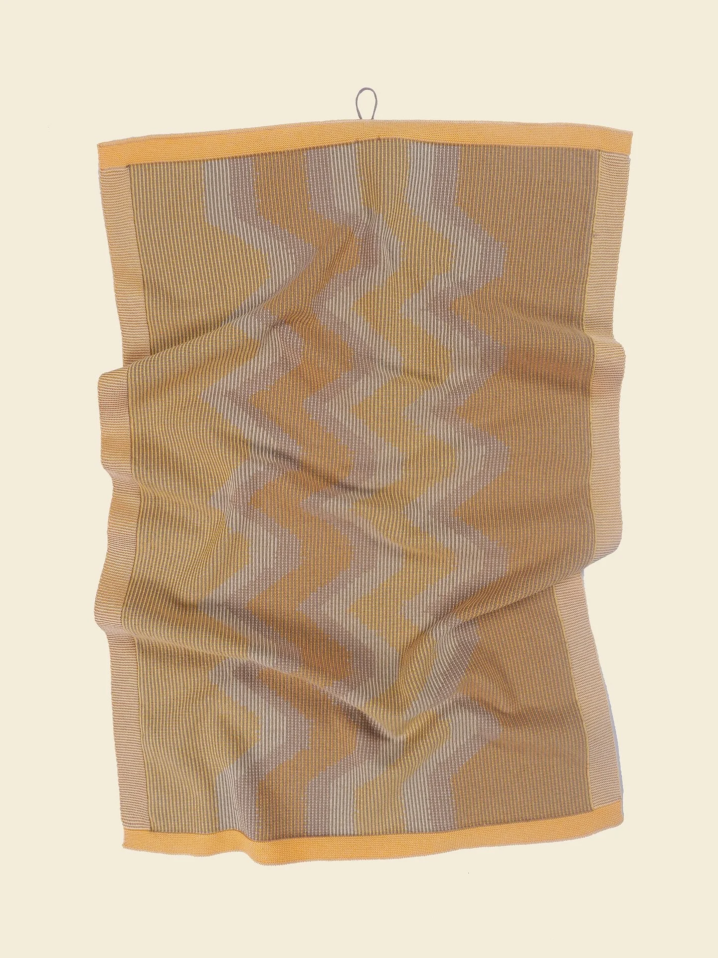 A set of two organic cotton kitchen towels. Shop at www.boi-knit.com

Inspired by woven ikat textiles, it embraces imprecise graphics for a unique, artistic look. The special weave-in technique adds stability to the towel, making It durable for count