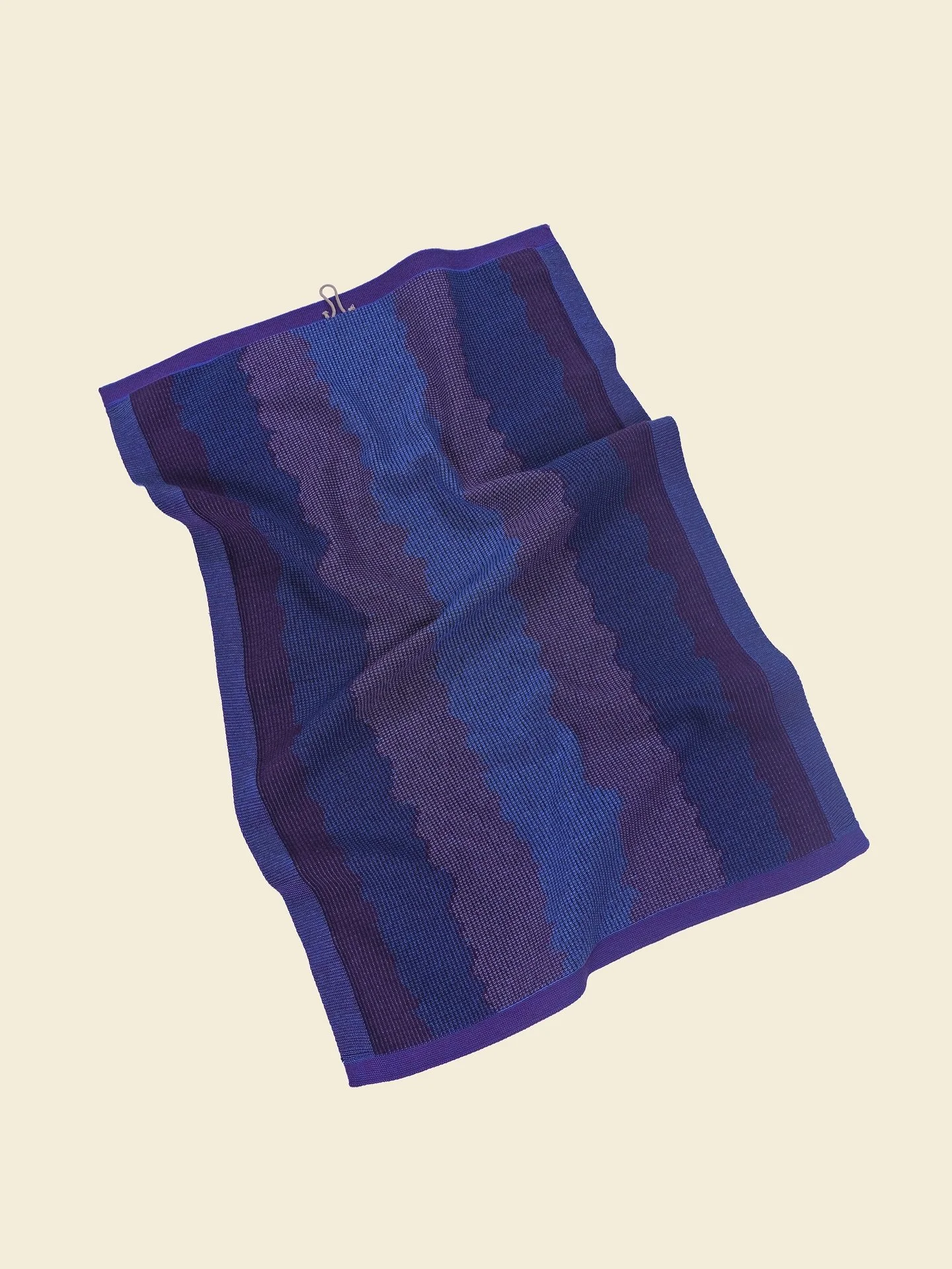 A set of two organic cotton kitchen towels with wavy monochrome graphic. Shop at www.boi-knit.com

Inspired by woven ikat textiles, it embraces imprecise graphics for a unique, artistic look. The special weave-in technique adds stability to the towel