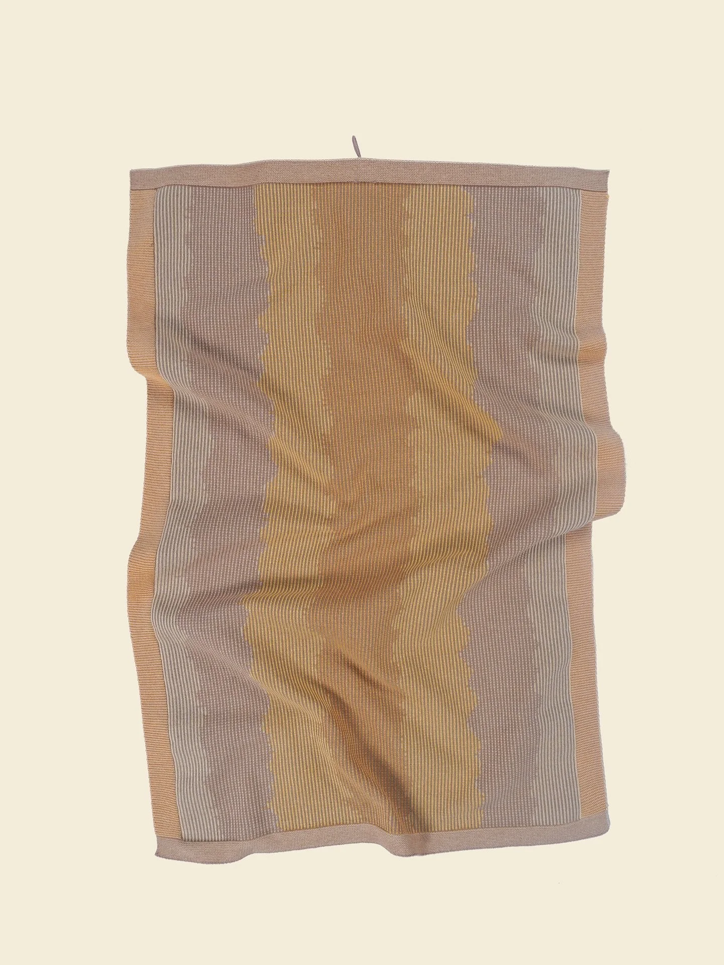 A set of two organic cotton kitchen towels in yellow. Shop at www.boi-knit.com

Inspired by woven ikat textiles, it embraces imprecise graphics for a unique, artistic look. The special weave-in technique adds stability to the towel, making It durable