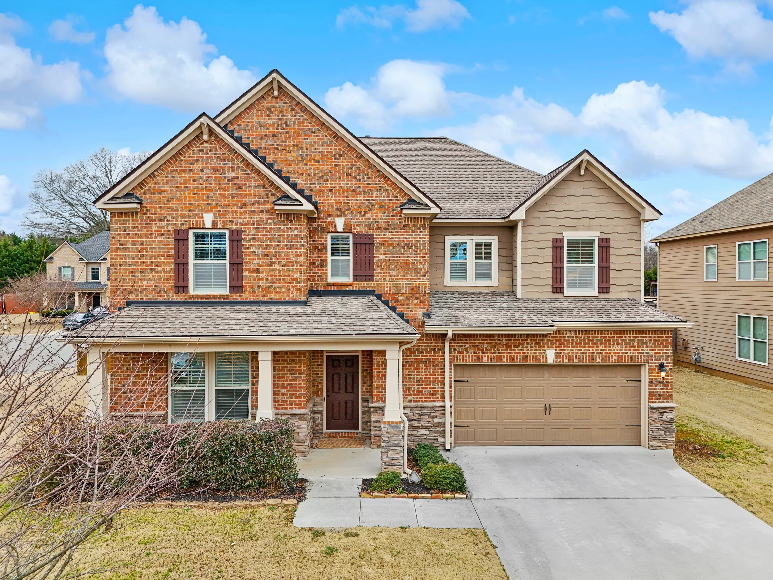 Traditional 4-bedroom home on a quiet corner lot in the Brookside community, West Forsyth.
