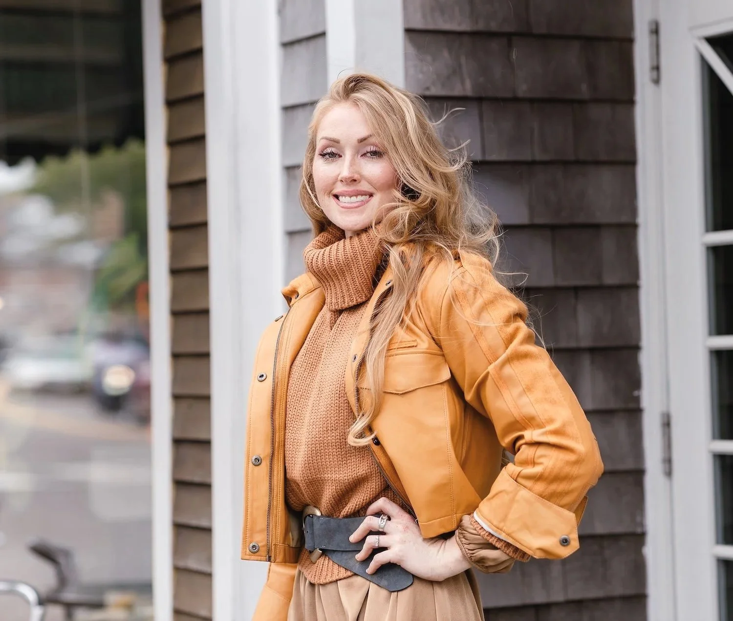 smiling red haired boutique owner