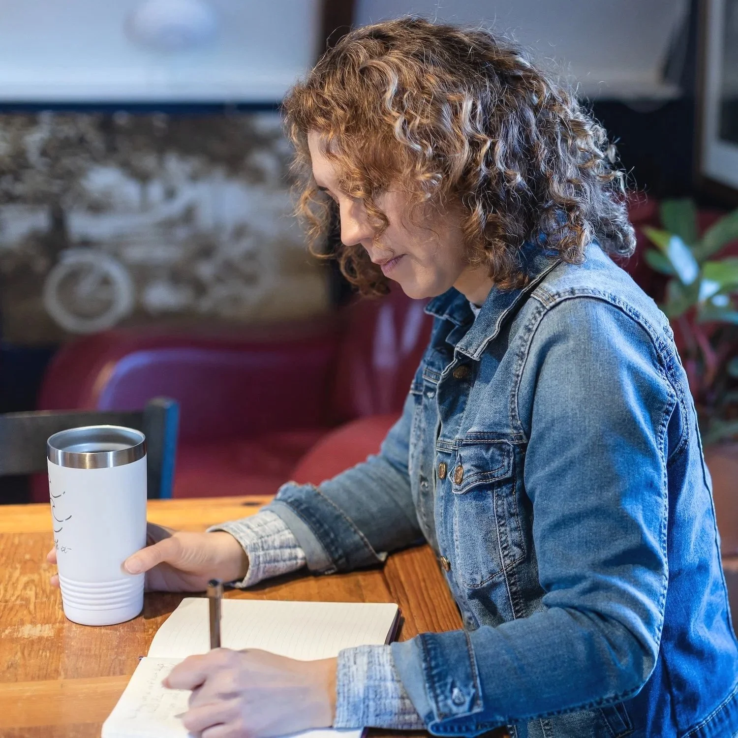 woman writing in journal