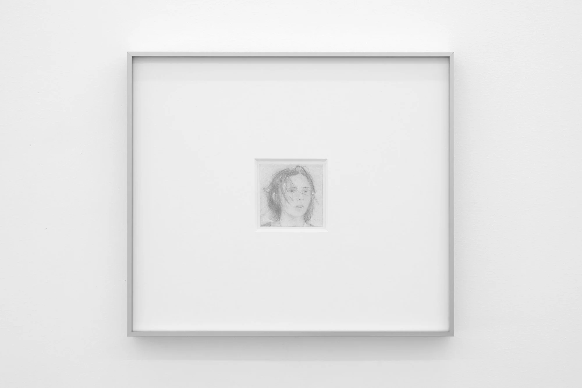 𝘈𝘵𝘳𝘦𝘺𝘶, 2026, Graphite and colored pencil on paper in artist frame, Framed 15.5 x 13.5 inches, unframed 3 x 3 inches 