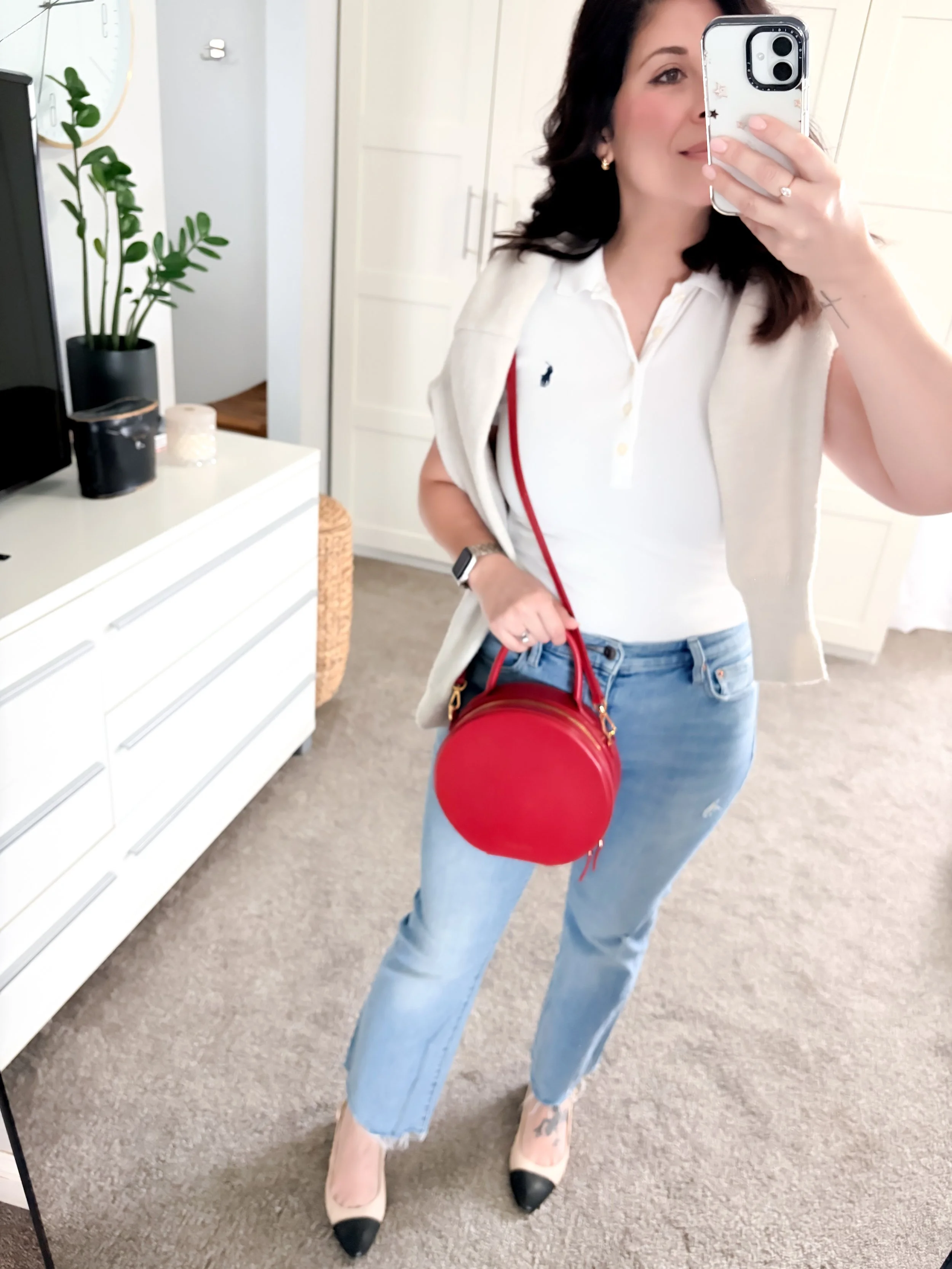 A Spring Outfit mirror selfie with jeans and a white Ralph Lauren Polo,  red handbag, and cap toe slingback pumps