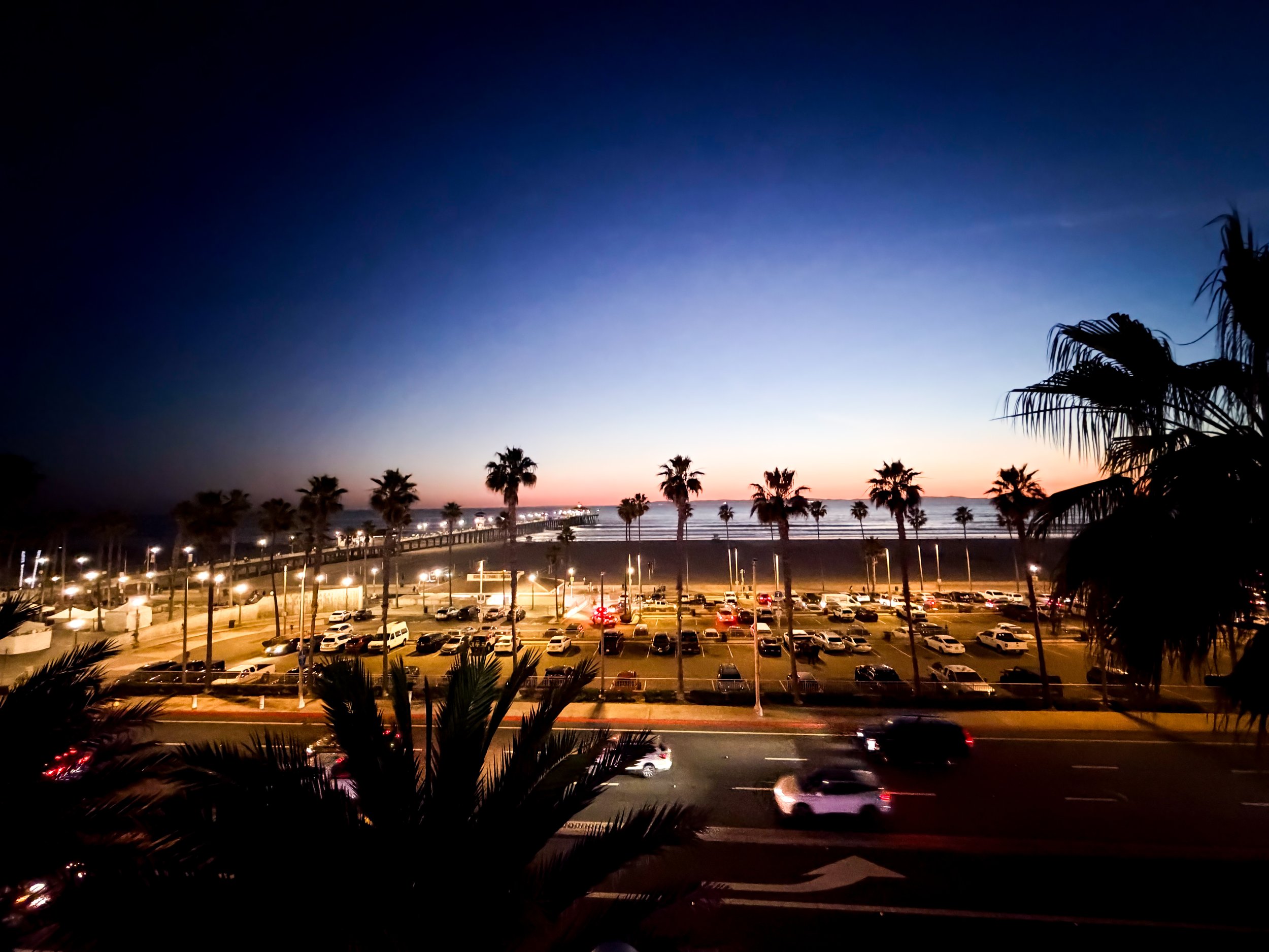 Sunset At Huntington beach with black palm trees