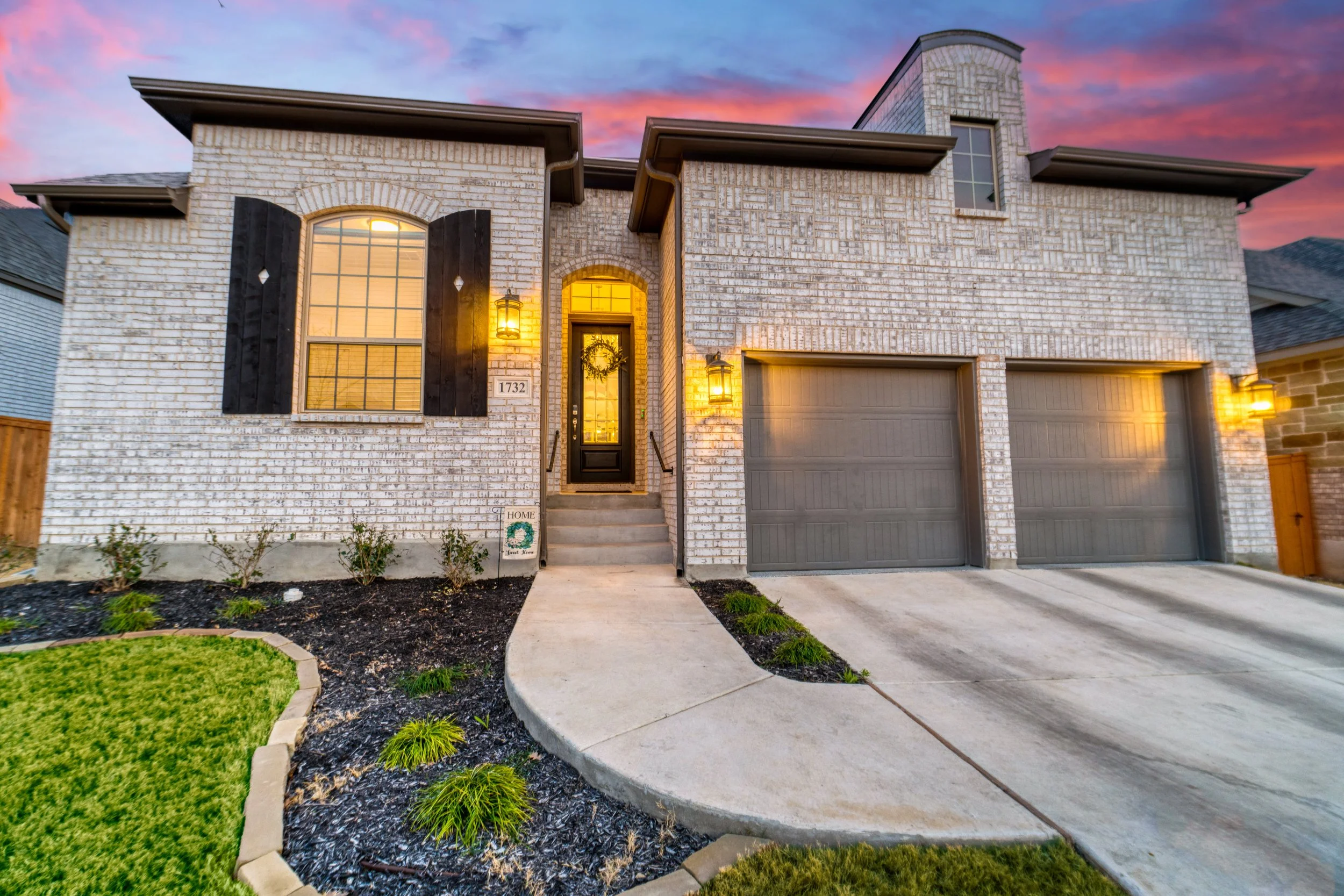A suburban home in Texas with a front landscape installed by the builders, that is struggling immensely due to the increasingly horrible weather conditions we are experiencing.