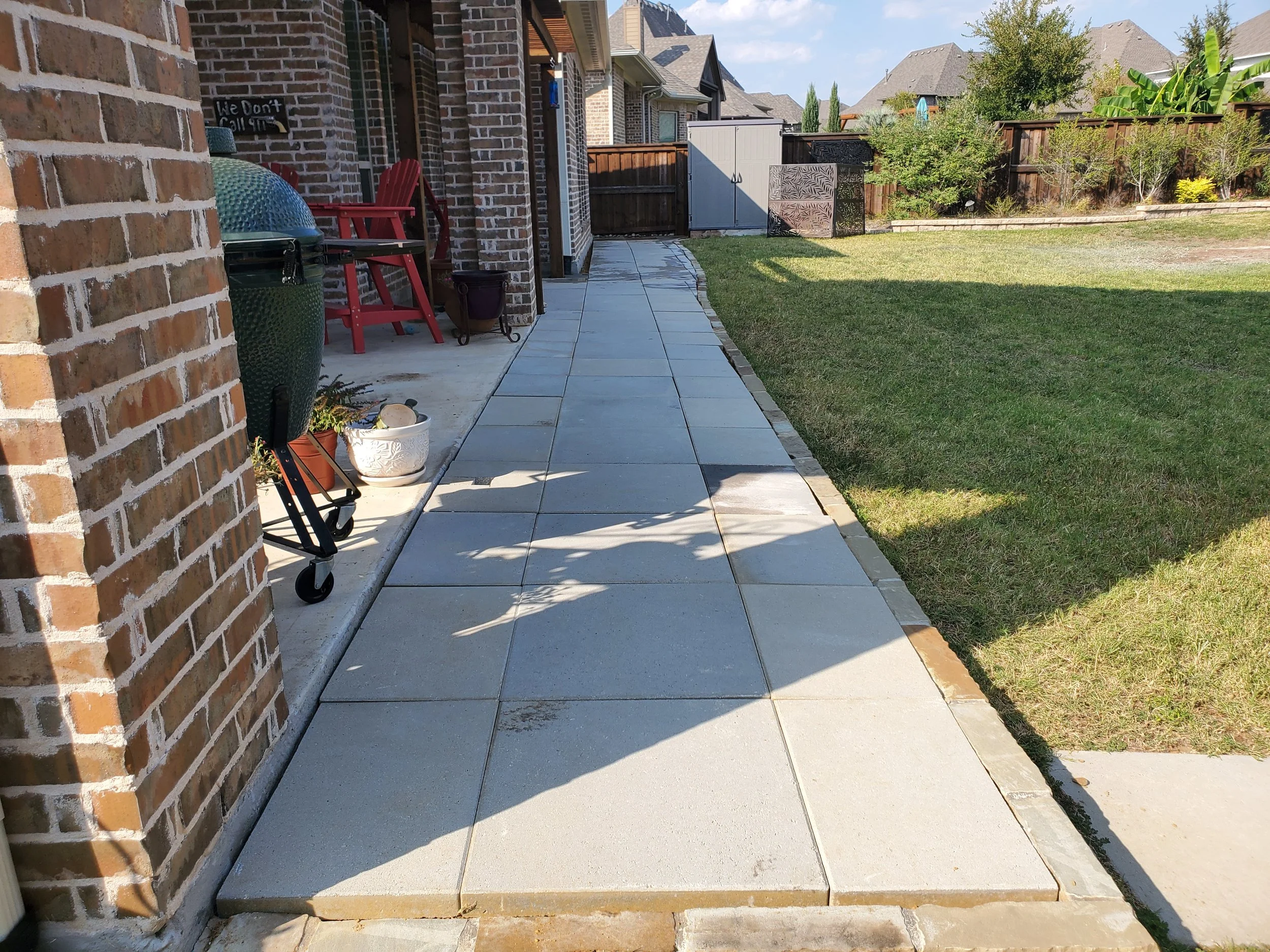 (Back Porch Angle 3) A concrete paver walkway that wraps entirely around the house, starting from the front driveway and ending all the way at the back porch. This replaced a decomposed granite walkway with minimal pavers that left a mess everywhere.