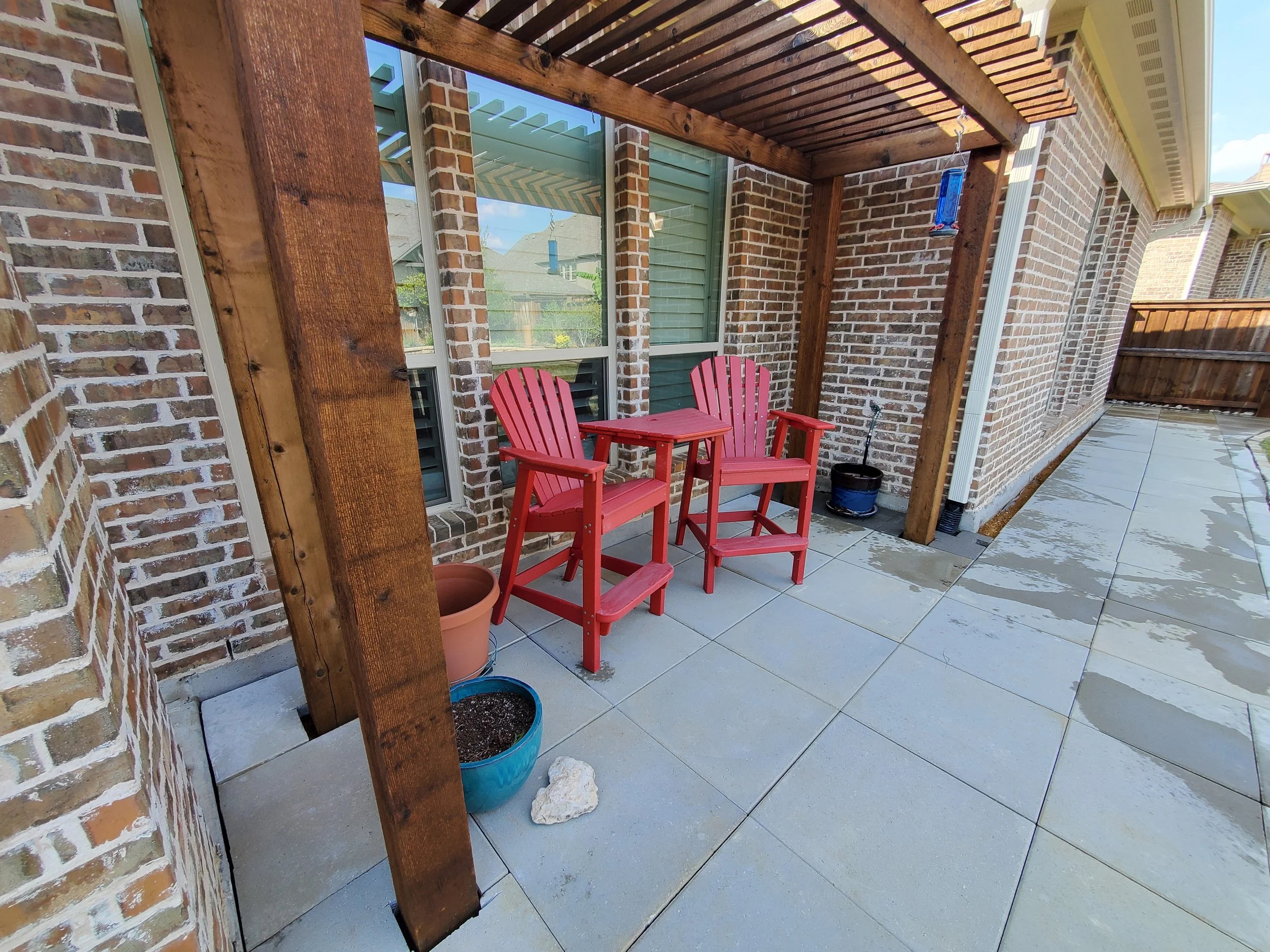(Back Porch Angle 2) A concrete paver walkway that wraps entirely around the house, starting from the front driveway and ending all the way at the back porch. This replaced a decomposed granite walkway with minimal pavers that left a mess everywhere.