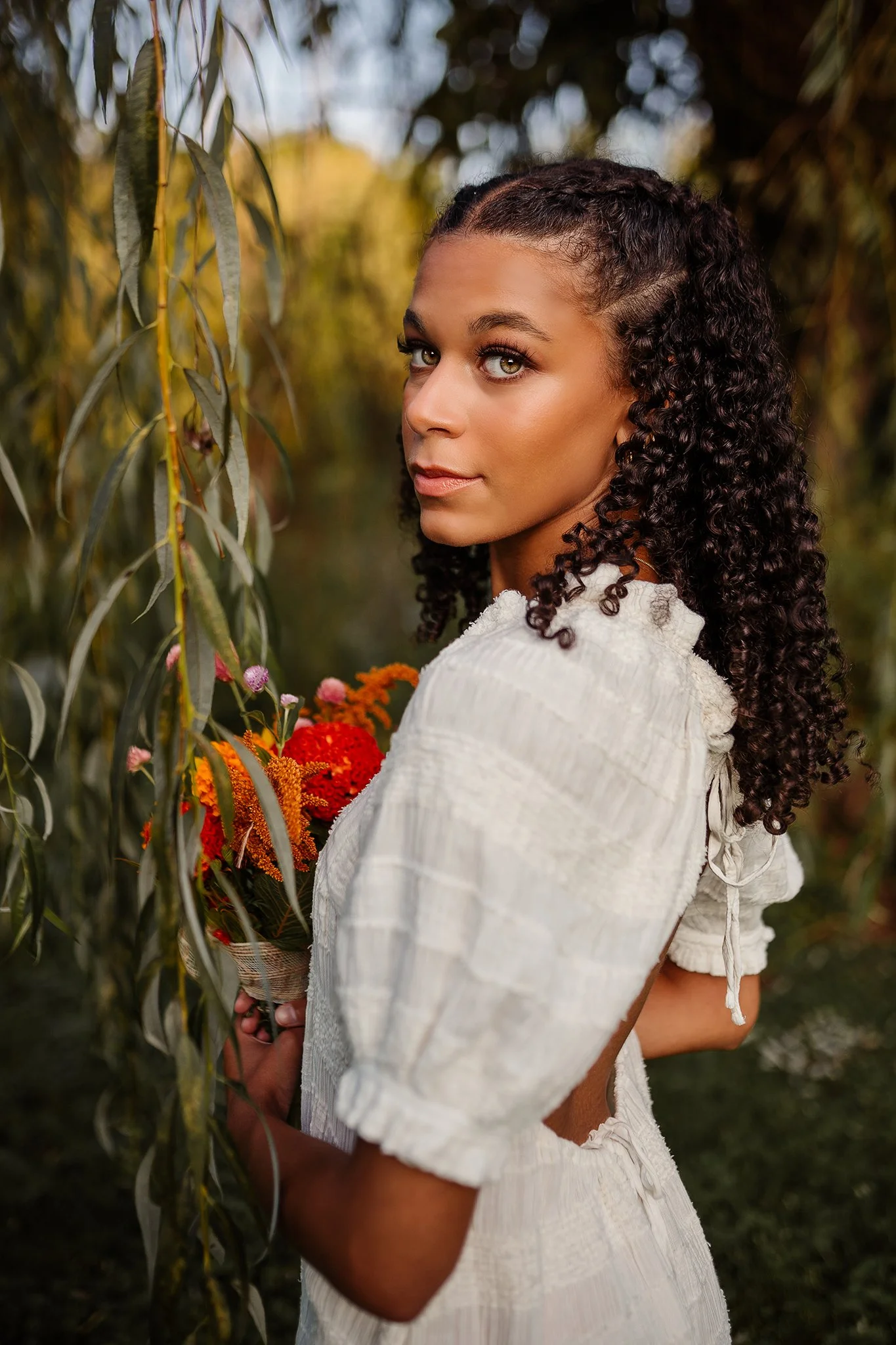 Outdoor senior dancer portraits at golden hour in Canal Fulton, Ohio with florals