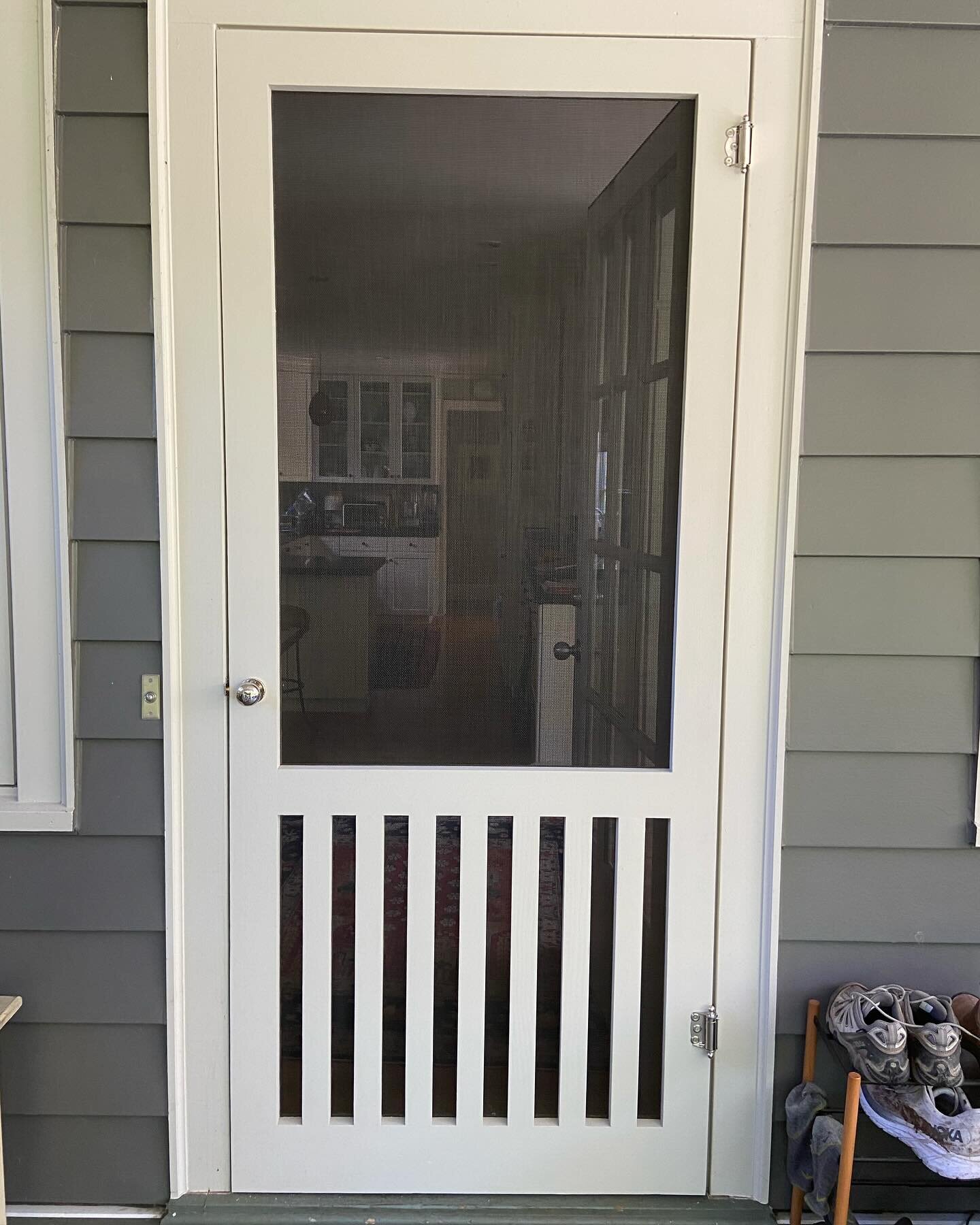 This custom Fannie-style screen door, color-matched to the trim, adds timeless sophistication to this Montlake home. With narrow rails inspired by the surrounding patio fence, it&rsquo;s both stylish and pet-friendly - keeping even their large dog at