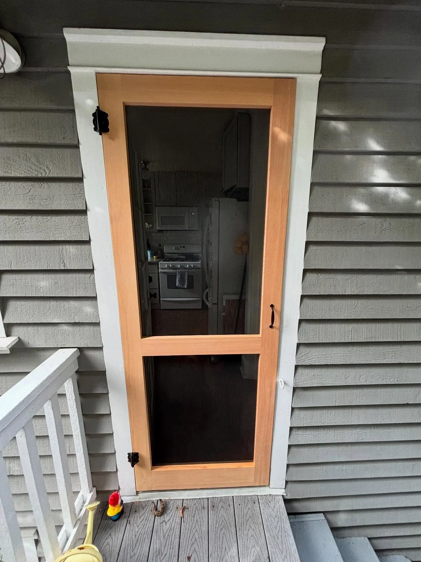This slim, simple door leads out the back and makes a big difference. Now the homeowners can leave the kitchen door open to enjoy the fresh air without worrying about their cats making a run for it.
#SeattleScreenDoors #Seattle #CustomWoodwork #Scre