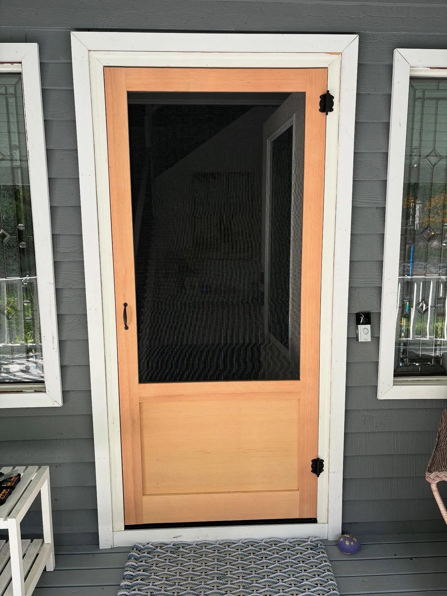 Set on a quiet lot in Redmond this home now has a pair of custom screen doors to match its peaceful surroundings. The solid lower panels and clean finish keep things simple and refined while adding just the right amount of detail. Built to blend in a